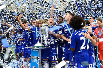 LONDON, ENGLAND - MAY 24:  John Terry of Chelsea celebrates lifts the trophy alongside team mates after the Barclays Premier League match between Chelsea and Sunderland at Stamford Bridge on May 24, 2015 in London, England. Chelsea were crowned Premier Le