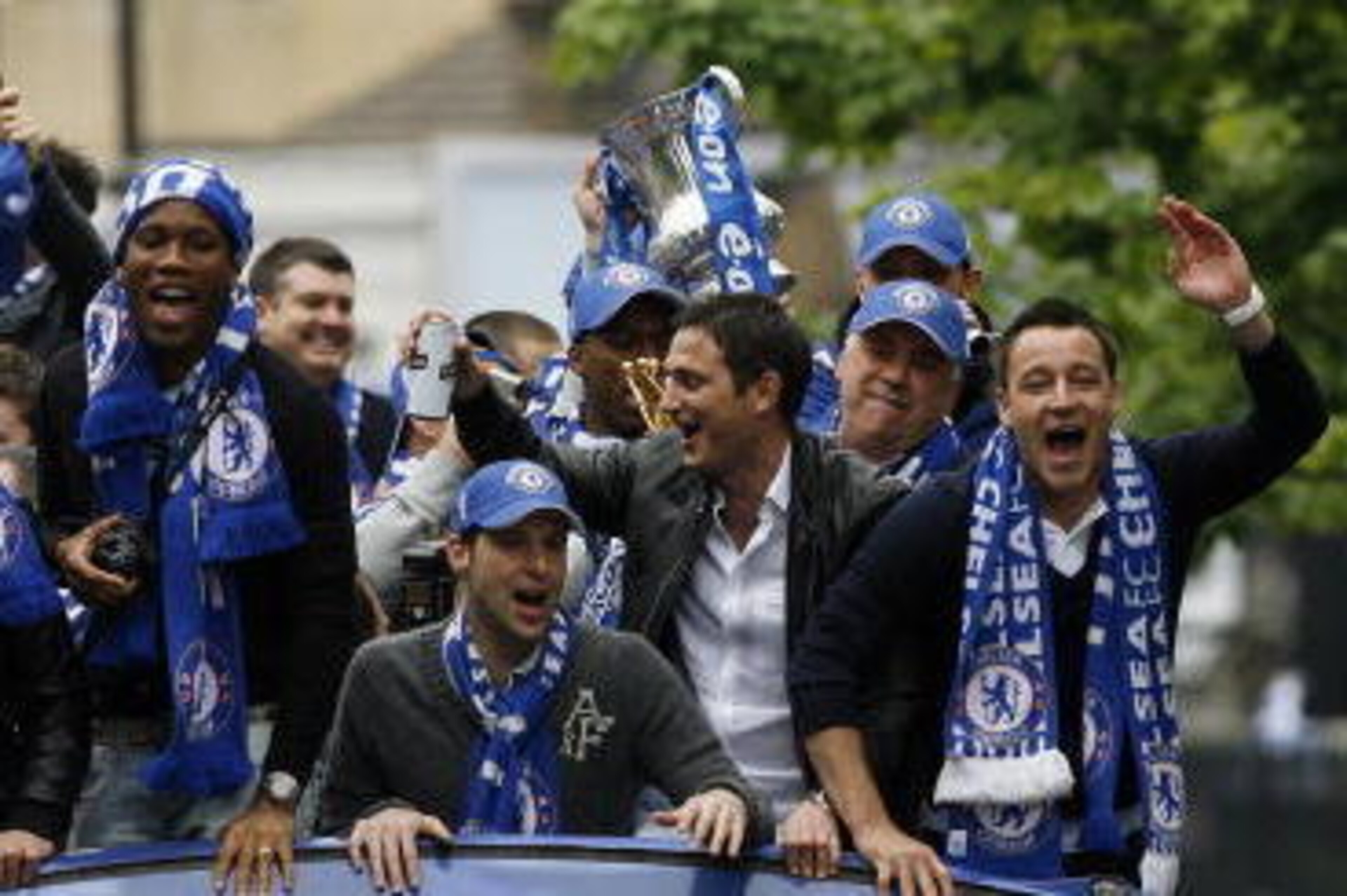 Chelsea's Captain John Terry (R), English midfielder Frank Lampard (2nd R), Czech goalkeeper Petr Cech (3rd R) and Ivorian striker Didier Drogba (L) show off the Barclays Premiership Trophy and FA Cup during their victory parade at Stamford Bridge, London Chelsea's Captain John Terry (R), English midfielder Frank Lampard (2nd R), Czech goalkeeper Petr Cech (3rd R) and Ivorian striker Didier Drogba (L) show off the Barclays Premiership Trophy and FA Cup during their victory parade at Stamford Bridge, London