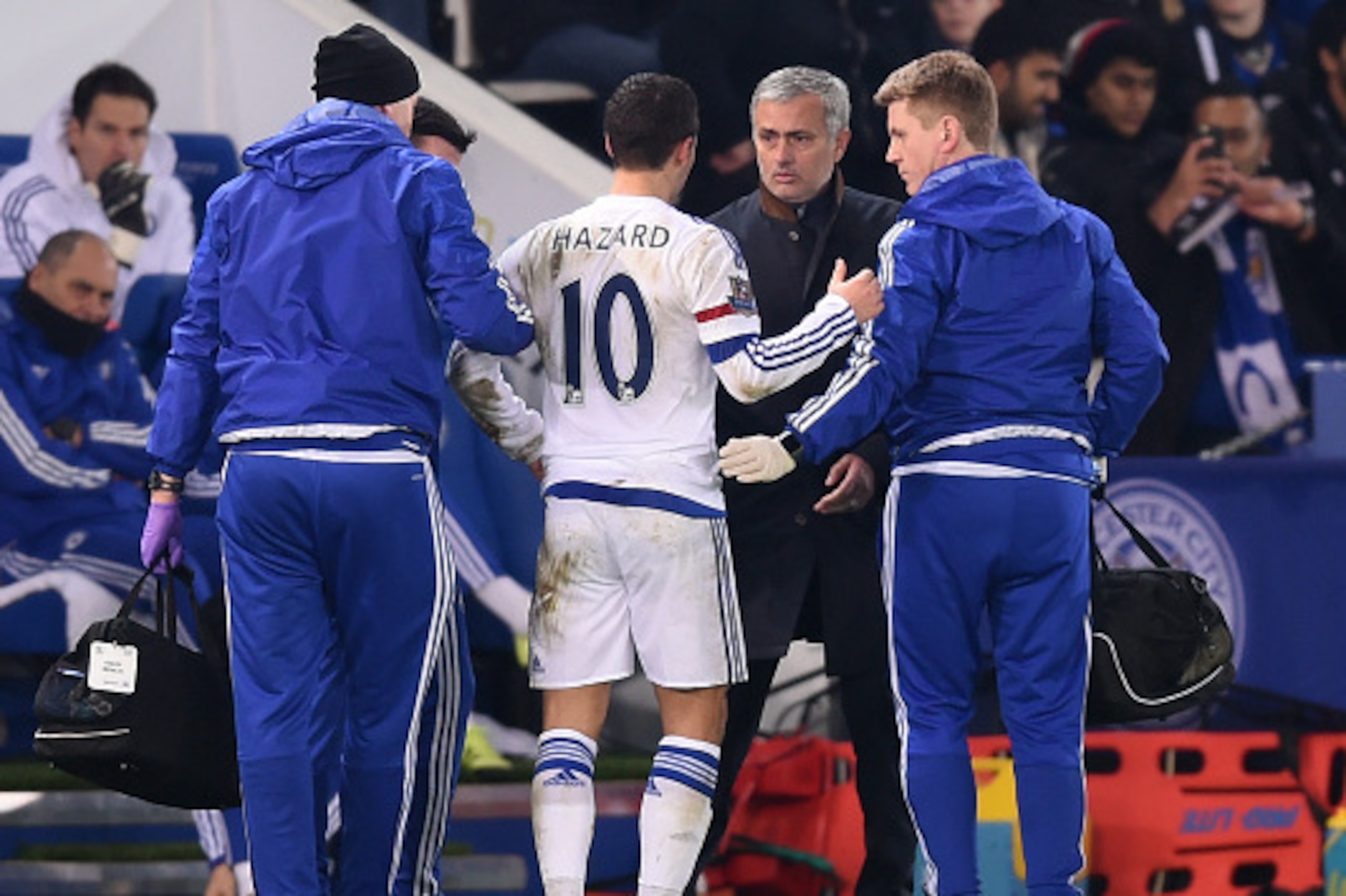 LEICESTER, ENGLAND - DECEMBER 14:  Jose Mourinho the manager of Chelsea speaks with Eden Hazard of Chelsea as he receives medical treatment during the Barclays Premier League match between Leicester City and Chelsea at the King Power Stadium on December14