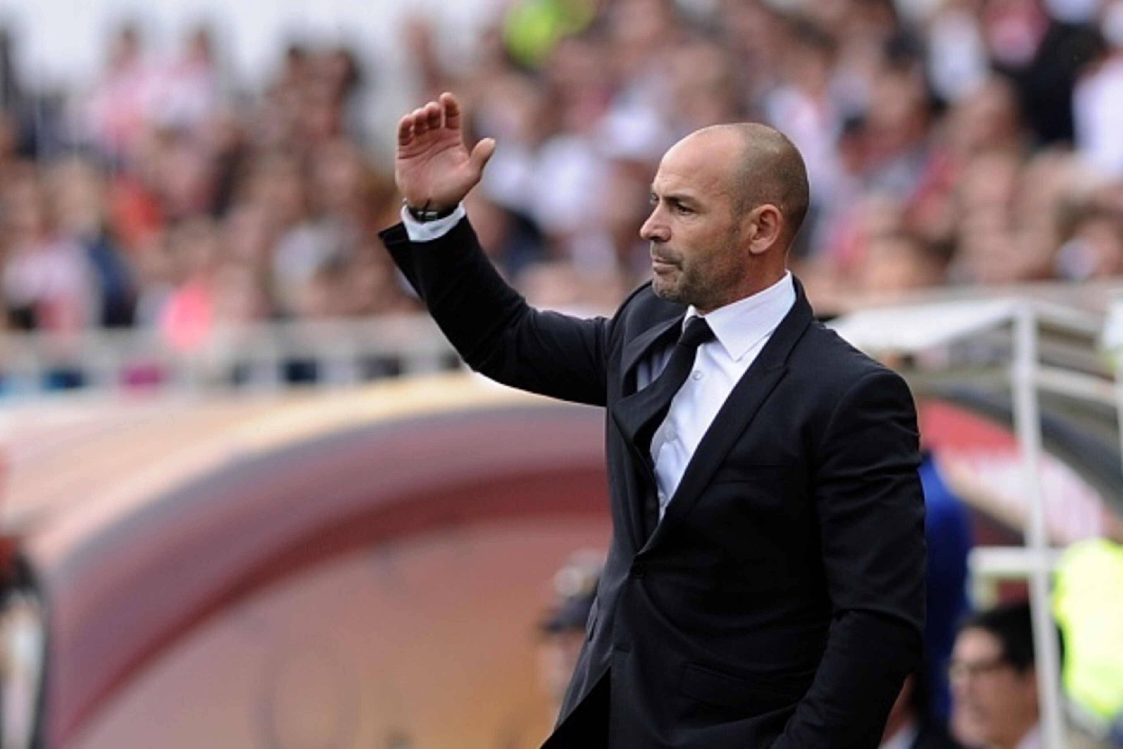Rayo Vallecano's coach Paco Jemez reacts during the Spanish league football match Sevilla FC vs Rayo Vallecano de Madrid at the Ramon Sanchez Pizjuan stadium in Sevilla on April 26, 2015. AFP PHOTO/ CRISTINA QUICLER (Photo credit should read CRIST Rayo Vallecano's coach Paco Jemez reacts during the Spanish league football match Sevilla FC vs Rayo Vallecano de Madrid at the Ramon Sanchez Pizjuan stadium in Sevilla on April 26, 2015. AFP PHOTO/ CRISTINA QUICLER (Photo credit should read CRIST