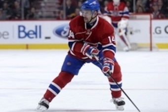 Nov 7, 2015; Montreal, Quebec, CAN; Montreal Canadiens forward Tomas Plekanec (14) skates with the puck during the first period against the Boston Bruins at the Bell Centre. Mandatory Credit: Eric Bolte-USA TODAY Sports