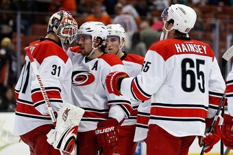 ANAHEIM, CA - DECEMBER 11:  Eddie Lack #31 of the Carolina Hurricanes, Justin Faulk #27 of the Carolina Hurricanes, and Ron Hainsey #65 of the Carolina Hurricanes react after a game against the Anaheim Ducks at Honda Center on December 11, 2015 in Anaheim