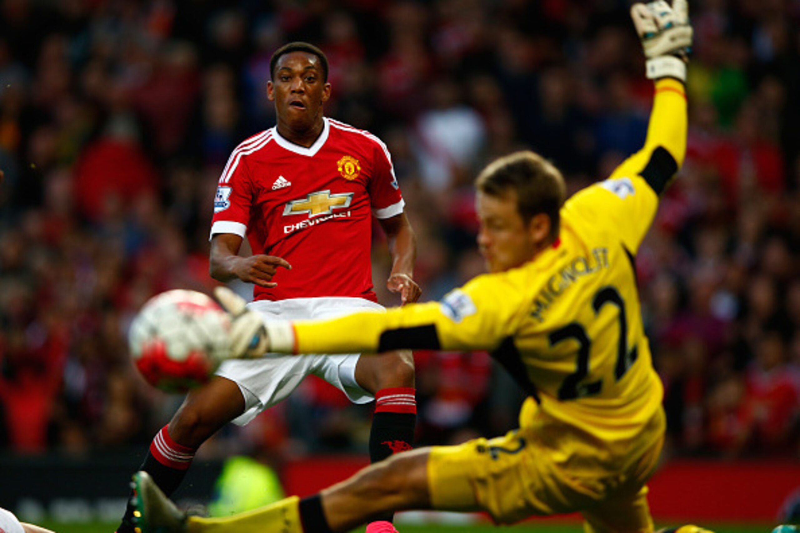 MANCHESTER, ENGLAND - SEPTEMBER 12:  Anthony Martial of Manchester United scores past Simon Mignolet of Liverpool for his team's third goal during the Barclays Premier League match between Manchester United and Liverpool at Old Trafford on September 12, 2
