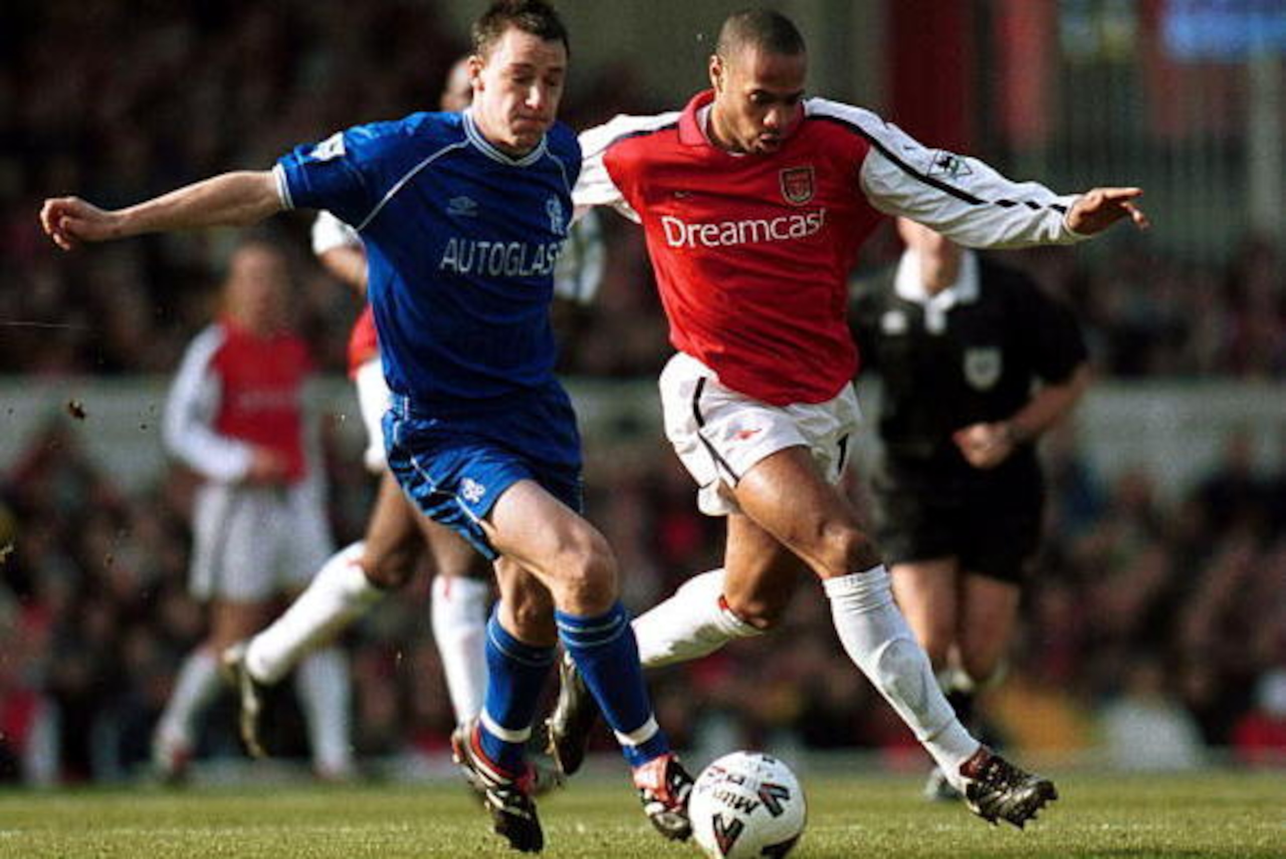 18 Feb 2001:  John Terry of Chelsea holds off the challenge of Thierry Henry of Arsenal during the match between Arsenal and Chelsea in the fifth round of the Axa Sponsored FA Cup at Highbury, London.  Mandatory Credit: Phil Cole/ALLSPORT