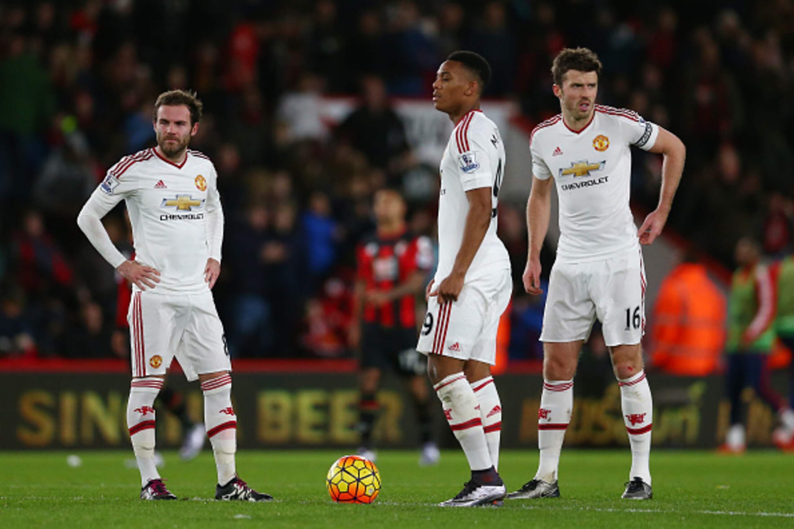 BOURNEMOUTH, ENGLAND - DECEMBER 12: (L to R) Juan Mata, Anthony Martial and Michael Carrick of Manchester United show their dejection after conceding second goal to Bournemouth during the Barclays Premier League match between A.F.C. Bournemouth and Manche BOURNEMOUTH, ENGLAND - DECEMBER 12: (L to R) Juan Mata, Anthony Martial and Michael Carrick of Manchester United show their dejection after conceding second goal to Bournemouth during the Barclays Premier League match between A.F.C. Bournemouth and Manche