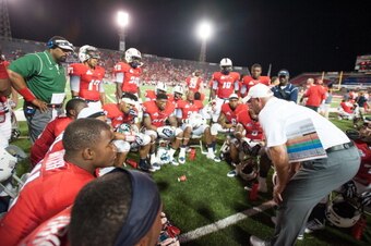 MOBILE, AL - AUGUST 29: Defensive coordinator Kevin Sherrer of the South Alabama Jaguars talks to his team during their game against the Southern Utah Thunderbirds on August 29, 2013 at Ladd-Peebles Stadium in Mobile, Alabama. Southern Utah defeated South