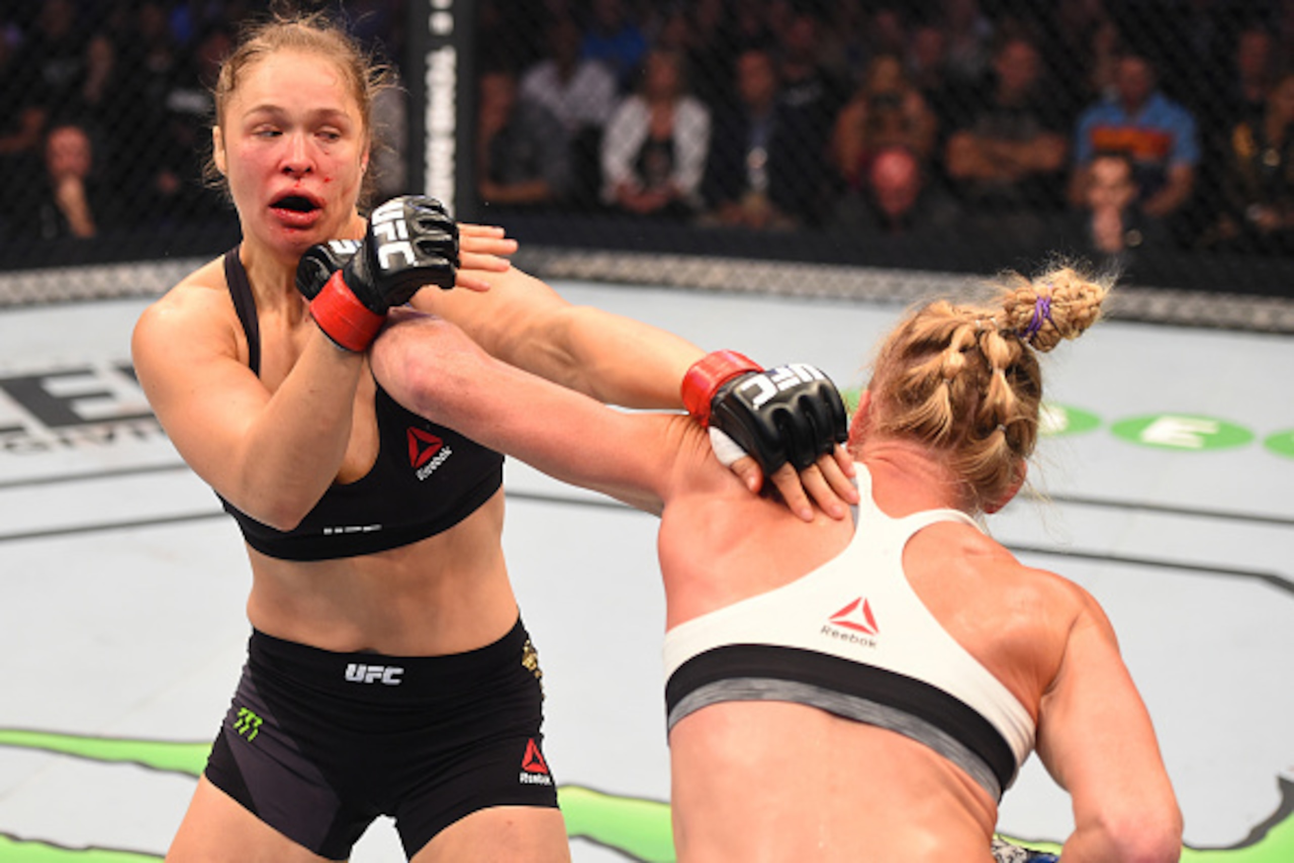 MELBOURNE, AUSTRALIA - NOVEMBER 15:  (R-L) Holly Holm of the United States punches Ronda Rousey of the United States in their UFC women's bantamweight championship bout during the UFC 193 event at Etihad Stadium on November 15, 2015 in Melbourne, Australi
