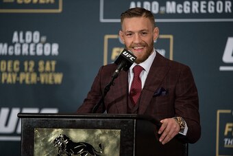 LAS VEGAS, NV - DECEMBER 12:  UFC featherweight champion Conor McGregor speaks to the media at the post fight press conference after his 13 second knockout victory over Jose Aldo in their featherweight championship fight during the UFC 194 event inside MG