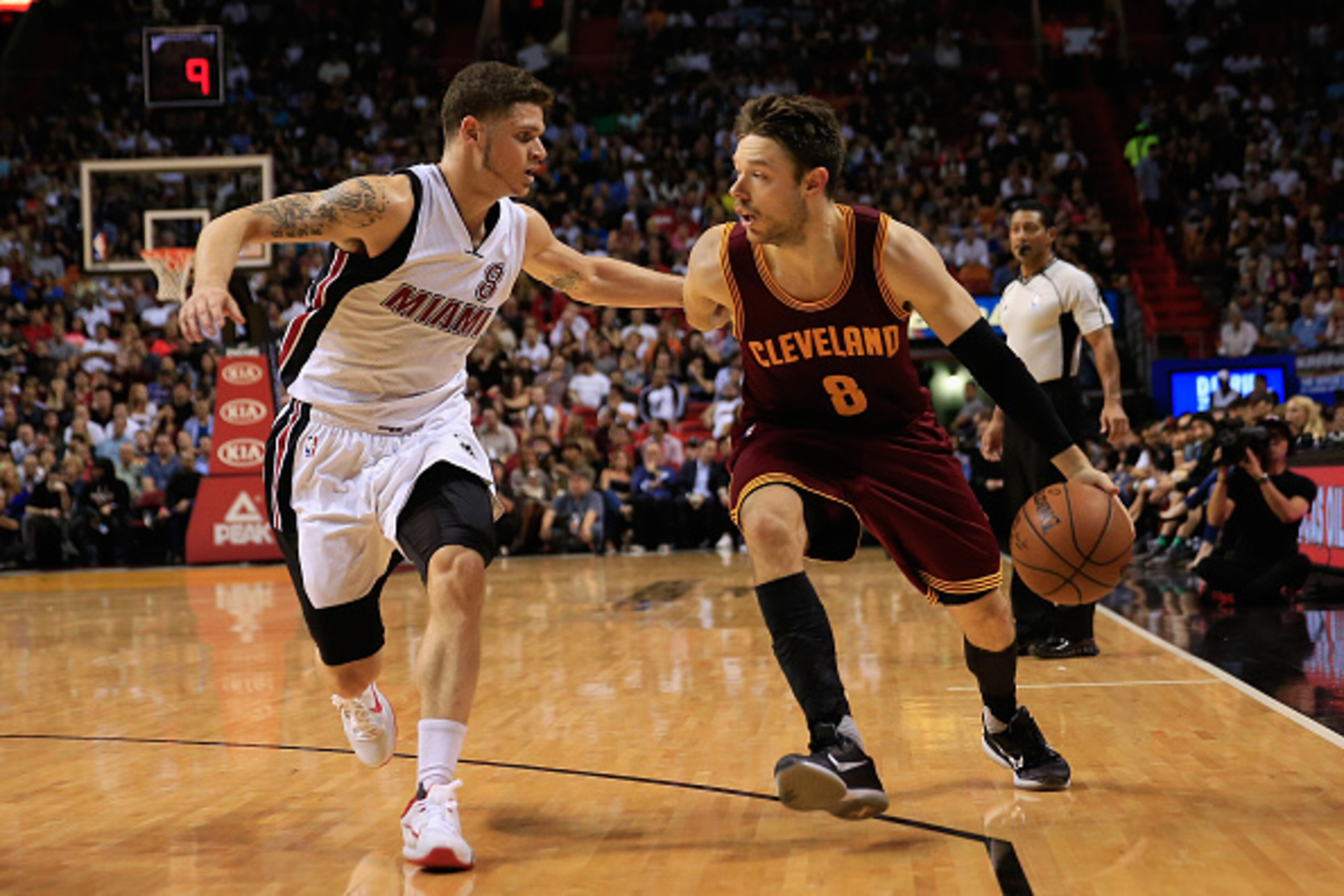MIAMI, FL - DECEMBER 05: Matthew Dellavedova #8 of the Cleveland Cavaliers dribbles the ball under pressure from Tyler Johnson #8 of the Miami Heat at American Airlines Arena on December 5, 2015 in Miami, Florida. NOTE TO USER: User expressly acknowledge MIAMI, FL - DECEMBER 05: Matthew Dellavedova #8 of the Cleveland Cavaliers dribbles the ball under pressure from Tyler Johnson #8 of the Miami Heat at American Airlines Arena on December 5, 2015 in Miami, Florida. NOTE TO USER: User expressly acknowledge