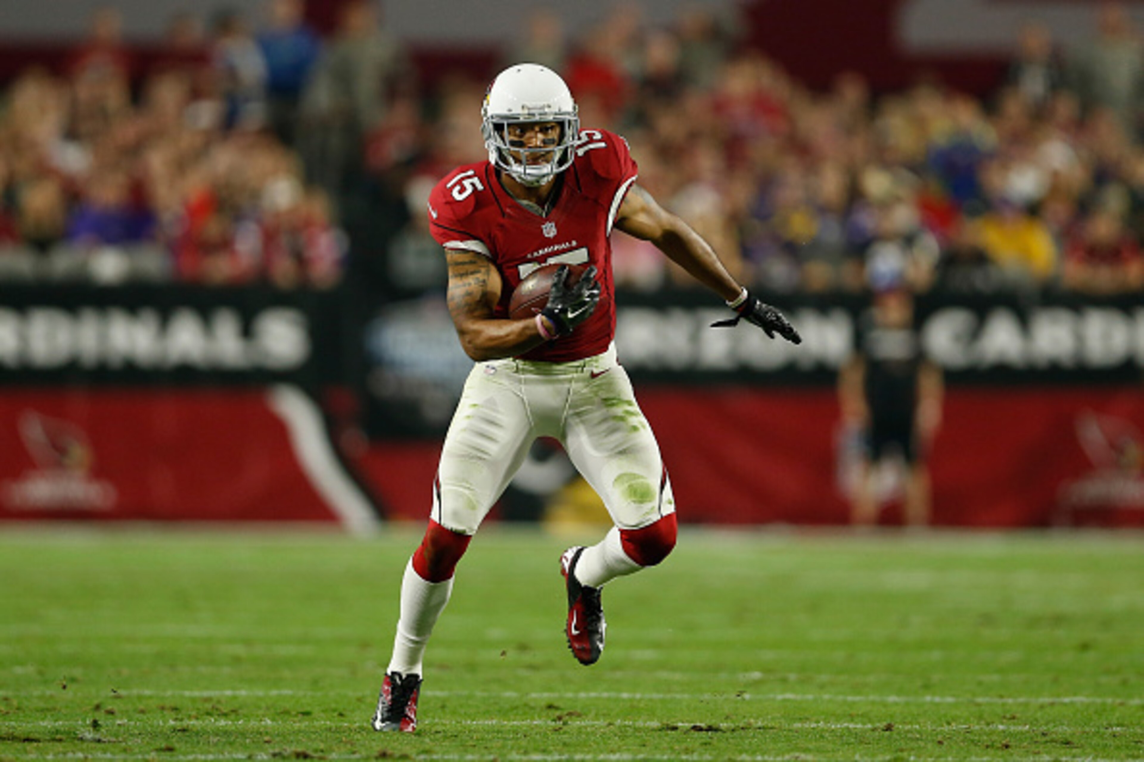 GLENDALE, AZ - DECEMBER 10:  Wide receiver Michael Floyd #15 of the Arizona Cardinals runs with the football after a reception during the NFL game at the University of Phoenix Stadium on December 10, 2015 in Glendale, Arizona. The Cardinals defeated the V