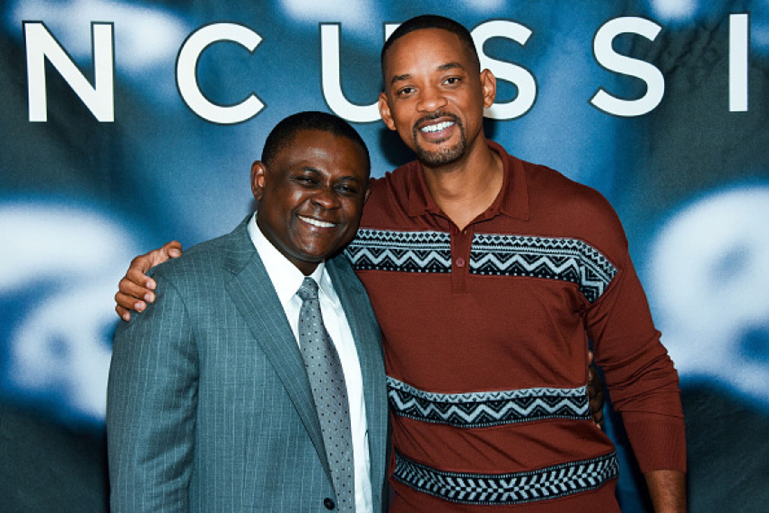 NEW YORK, NY - DECEMBER 14:  Dr. Bennet Omalu and Will Smith attend the 'Concussion' Cast Photo Call at Crosby Street Hotel on December 14, 2015 in New York City.  (Photo by Grant Lamos IV/Getty Images)