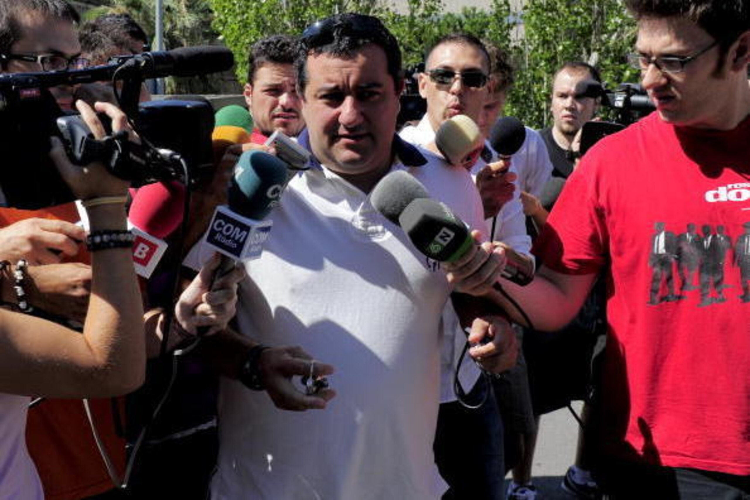 Representative for Barcelona's Swedish forward Zlatan Ibrahimovic, Mino Raiola (C), arrives  at the offices of Barcelona FC allegedly to sign Ibrahimovic, in Barcelona on August 26, 2010.  Swedish forward Zlatan Ibrahimovic revealed that his Barcelona bos