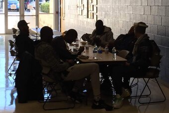 Jason Thompson, Festus Ezeli, Harrison Barnes, Draymond Green, Andre Iguodala and Stephen Curry (left to right) at their makeshift lunch table, eating Chipotle and laughing, outside the gym at Johnson & Wales University in Charlotte.