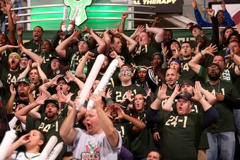 Milwaukee, WI - DECEMBER 12: The fans of Milwaukee Bucks cheer them on during the game against the Golden State Warriors on December 12, 2015 at the BMO Harris Bradley Center in Milwaukee, Wisconsin. NOTE TO USER: User expressly acknowledges and agrees th