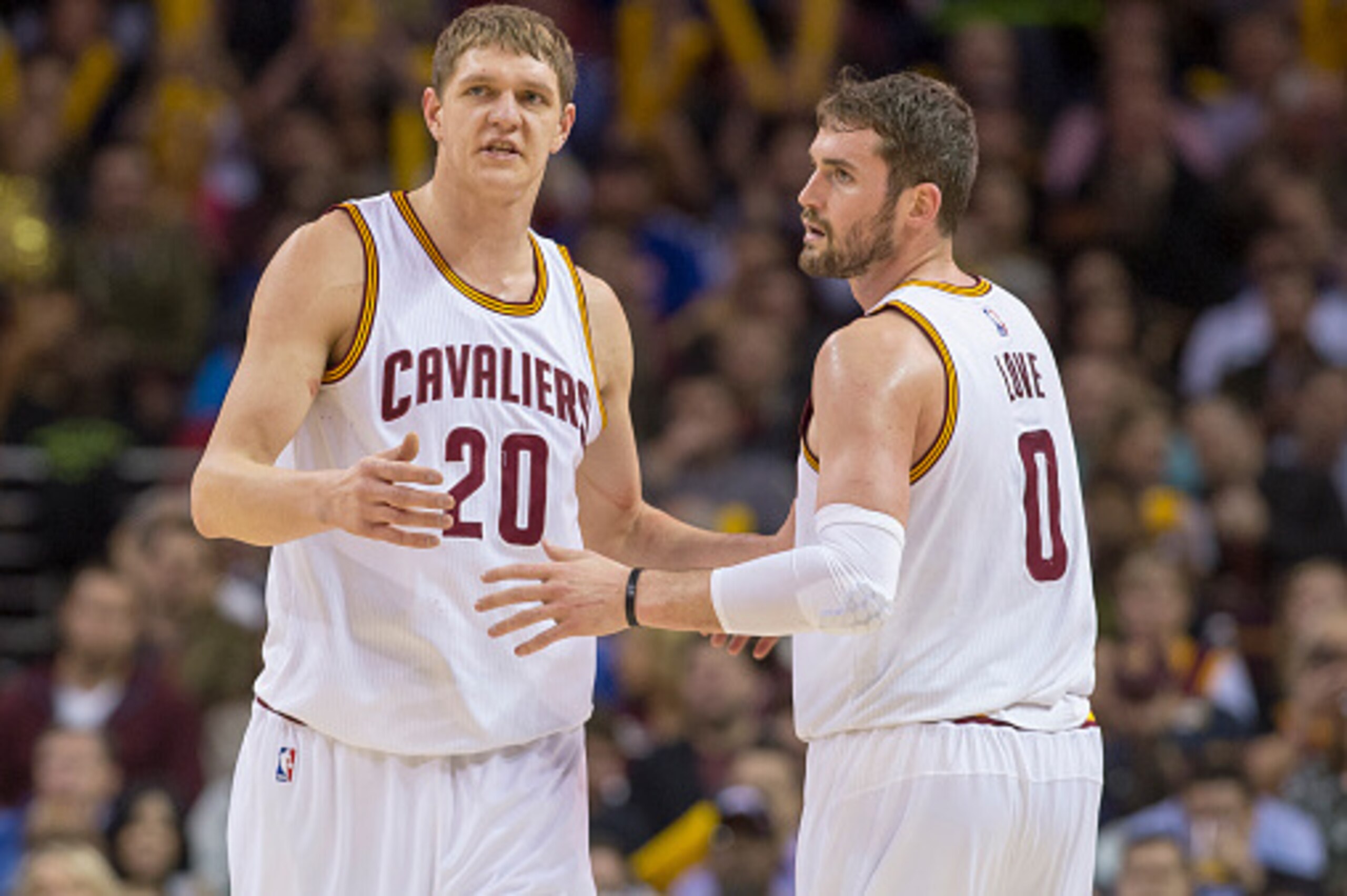 CLEVELAND, OH - MARCH 7: Timofey Mozgov #20 of the Cleveland Cavaliers and Kevin Love #0 of the Cleveland Cavaliers talk about a play during the first half against the Phoenix Suns at Quicken Loans Arena on March 7, 2015 in Cleveland, Ohio. NOTE TO USER: 