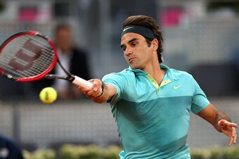 MADRID, SPAIN - MAY 06:  Roger Federer of Switzerland plays a forehand in his match against Nick Kyrgios of Australia in their second round match during day five of the Mutua Madrid Open tennis tournament at the Caja Magica  on May 6, 2015 in Madrid, Spai