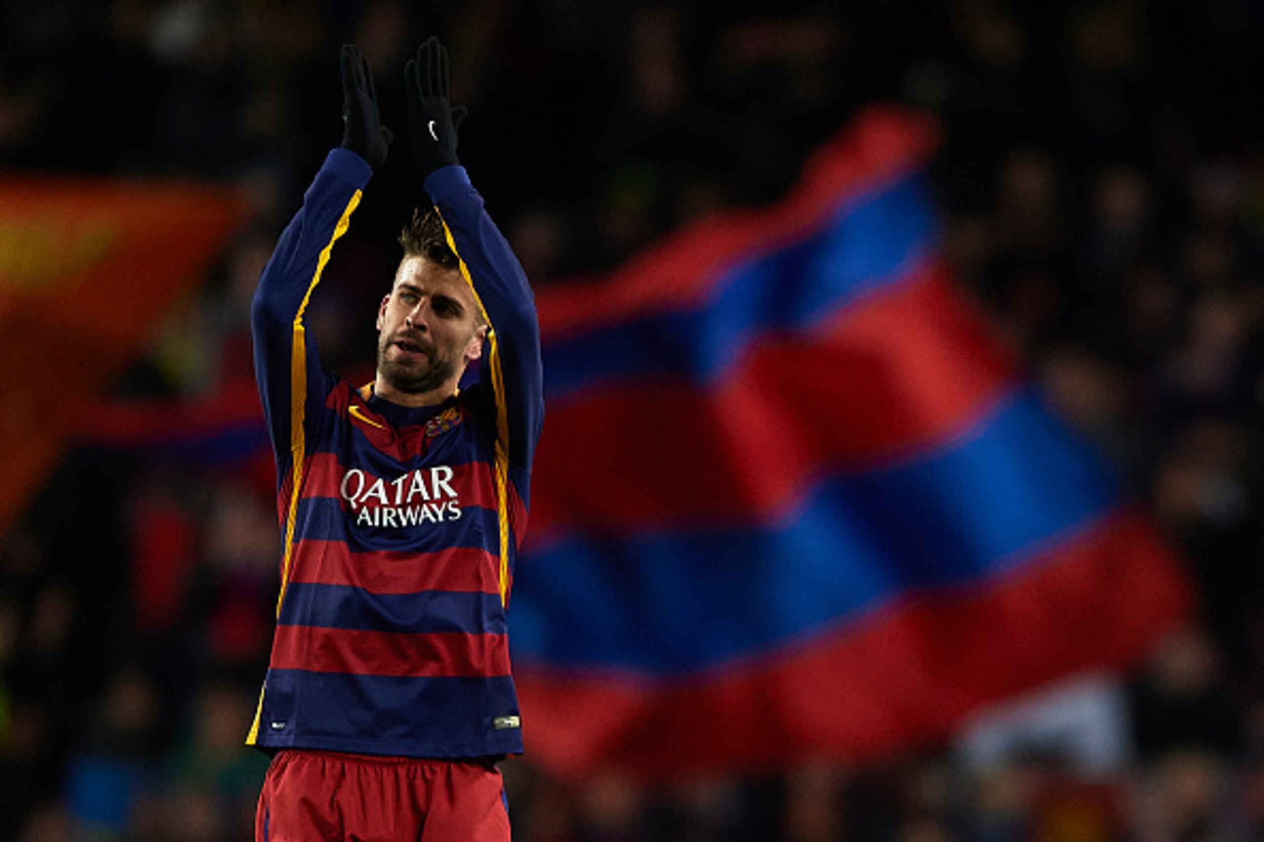 BARCELONA, SPAIN - NOVEMBER 24:  Gerard Pique of Barcelona greets the fans during the UEFA Champions League Group E match between FC Barcelona and AS Roma at Camp Nou on November 24, 2015 in Barcelona, Spain.  (Photo by Manuel Queimadelos Alonso/Getty Ima