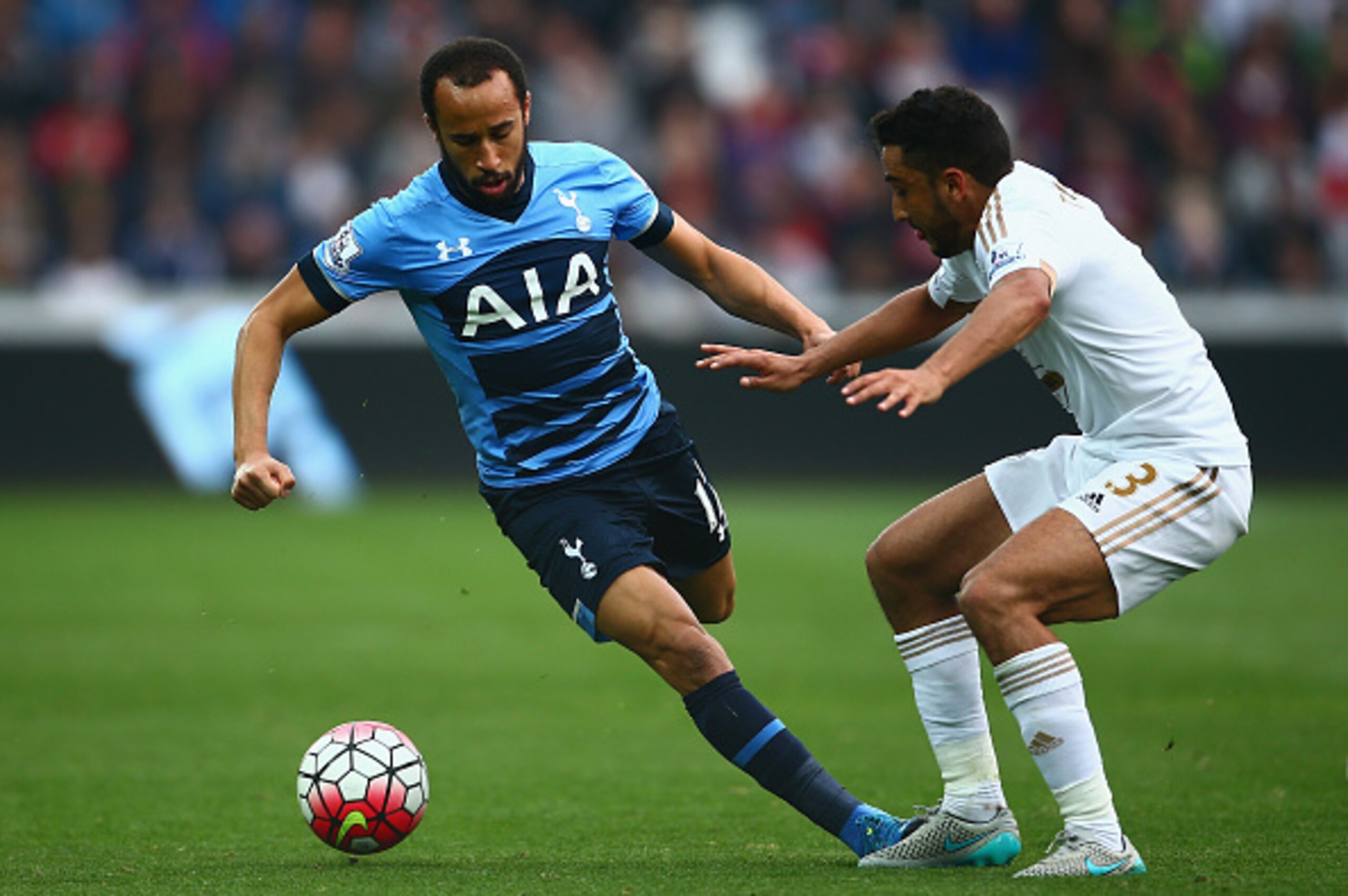 SWANSEA, WALES - OCTOBER 04: Andros Townsend of Tottenham Hotspur and Neil Taylor of Swansea City in action during the Barclays Premier League match between Swansea City and Tottenham Hotspur at Liberty Stadium on October 4, 2015 in Swansea, Wales.  (Phot