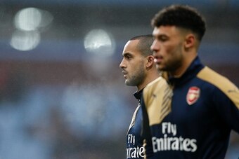 Arsenal's English midfielder Theo Walcott (L) and Arsenal's English midfielder Alex Oxlade-Chamberlain warm up ahead of the English Premier League football match between Aston Villa and Arsenal at Villa Park in Birmingham, central England on December 13, 