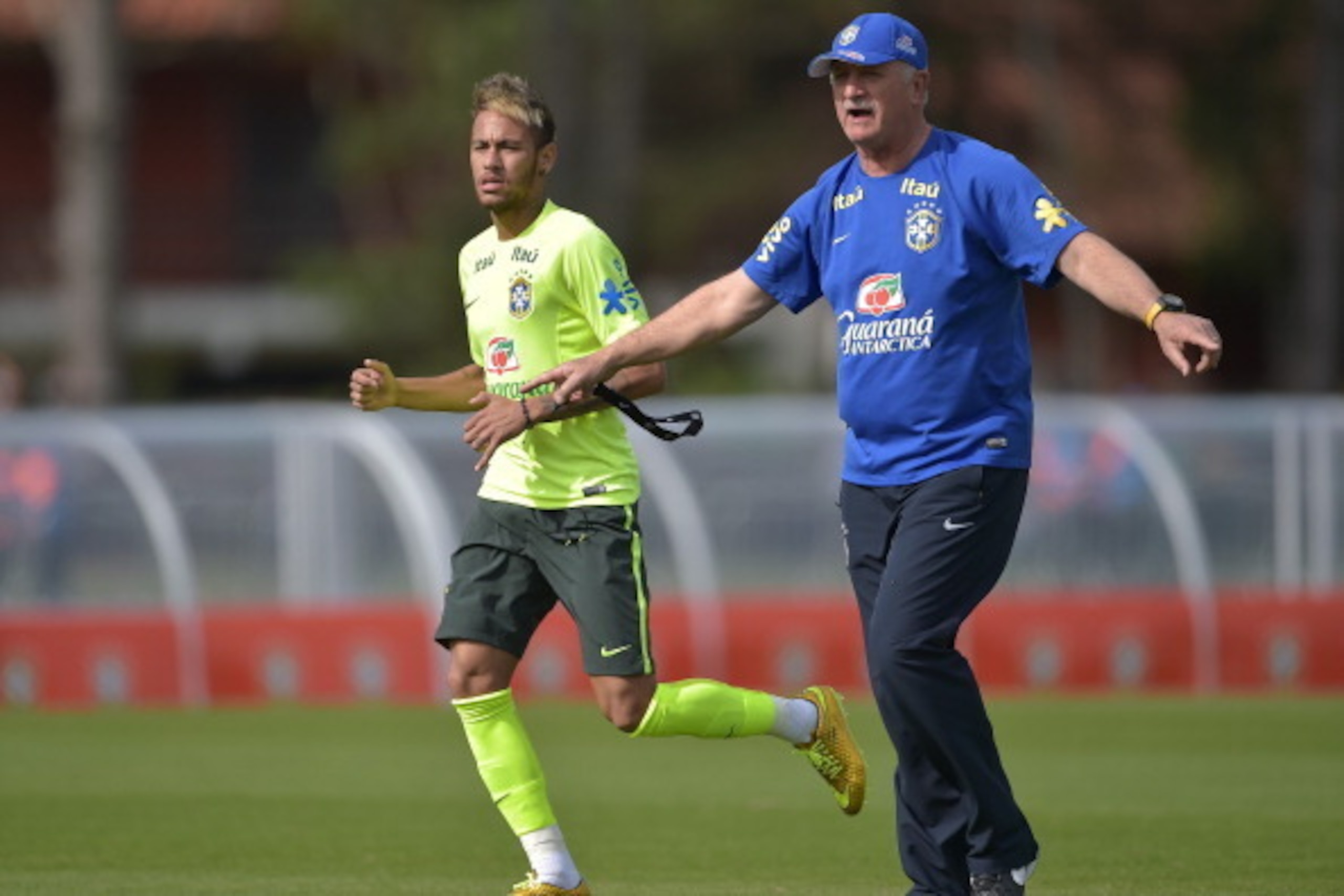TERESOPOLIS, BRAZIL - JUNE 26: Head coach Luiz Felipe Scolari gives instructions for Neymar during a training session of the Brazilian national football team at the squad's Granja Comary training complex, on June 26, 2014 in Teresopolis, 90 km from downto