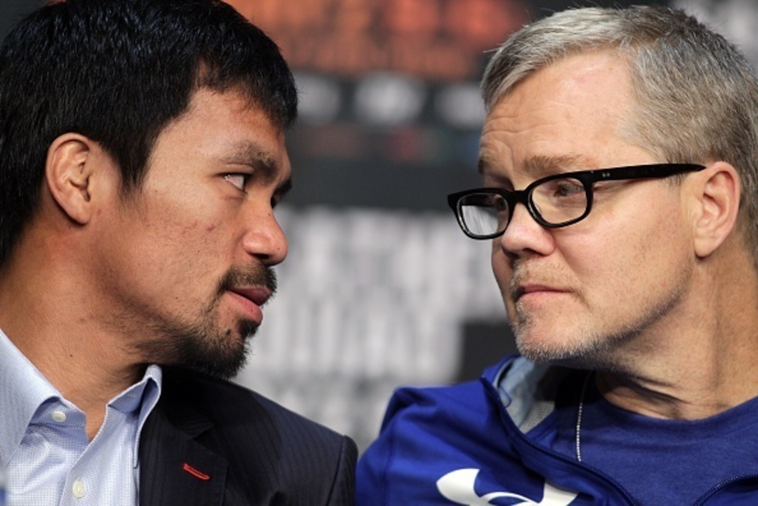 WBO welterweight champion Manny Pacquiao (L) talks with his trainer Freddie Roach during a news conference at the KA Theatre at MGM Grand Hotel & Casino on April 29, 2015 in Las Vegas, Nevada. Pacquiao will face WBC/WBA welterweight champion Floyd Mayweat