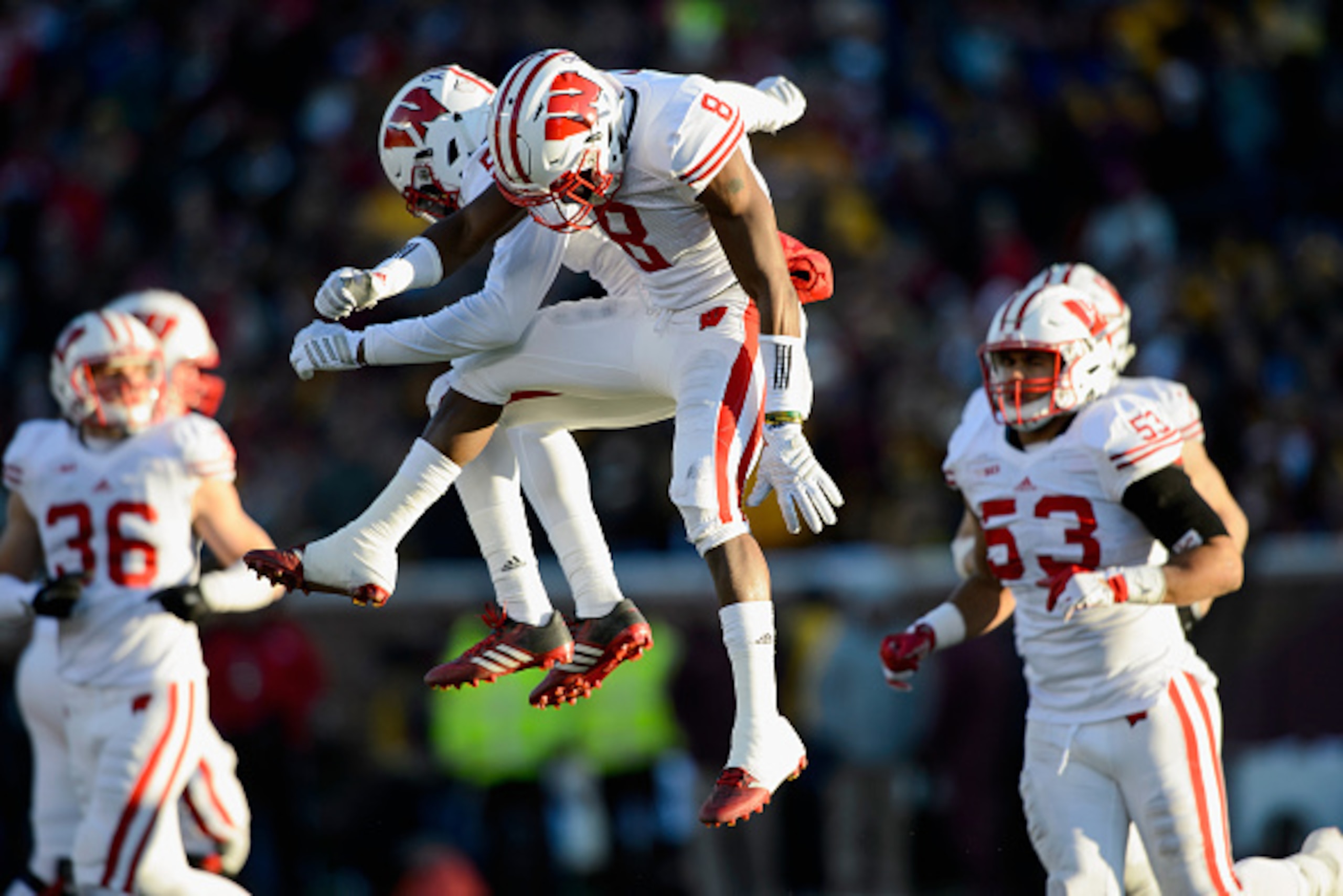MINNEAPOLIS, MN - NOVEMBER 28: Darius Hillary #5 and Sojourn Shelton #8 of the Wisconsin Badgers celebrate a fumble recovery by Hillary against the Minnesota Golden Gophers during the second quarter of the game on November 28, 2015 at TCF Bank Stadium in 
