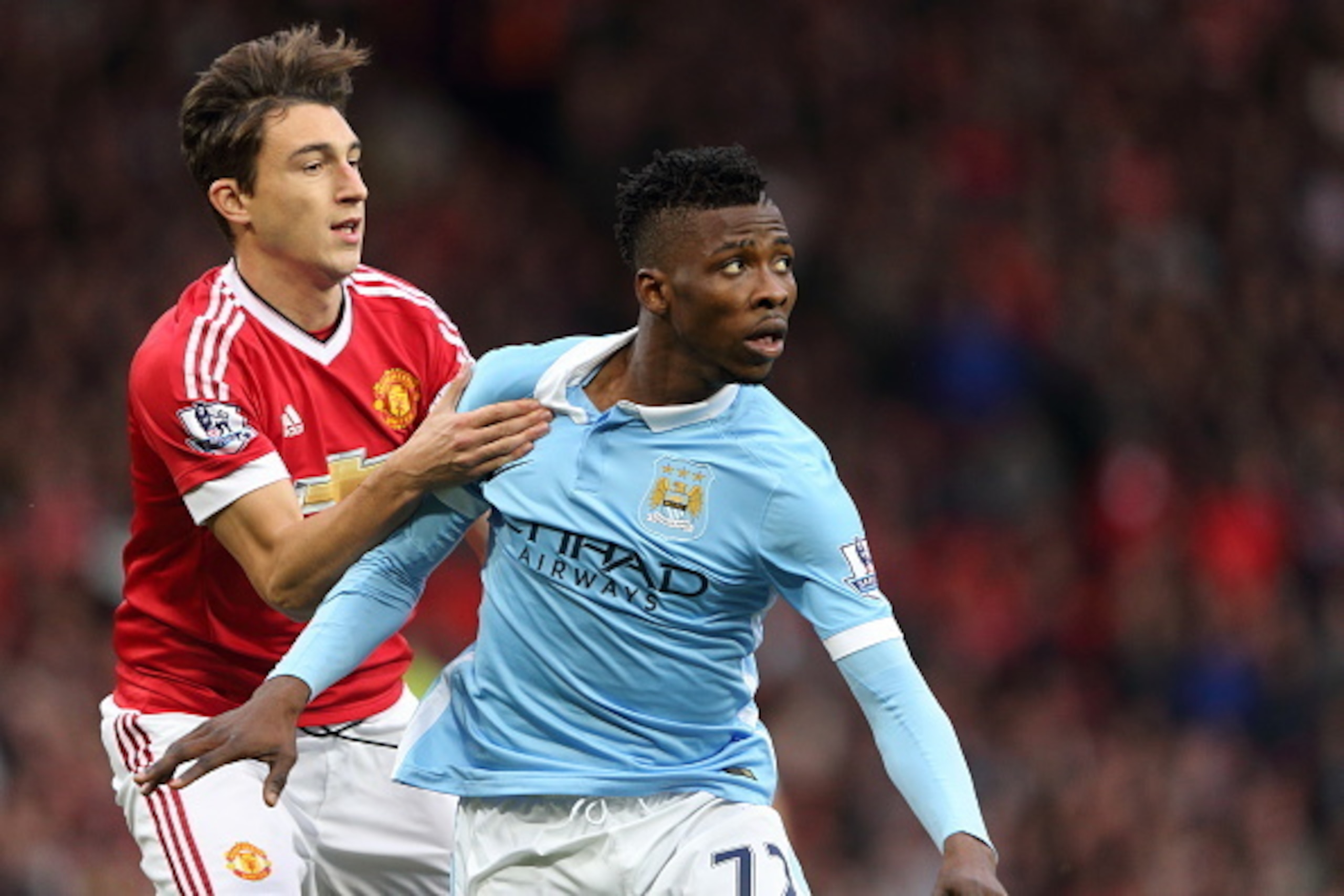 MANCHESTER, ENGLAND - OCTOBER 25:  Matteo Darmian of Manchester United holds back Kelechi Iheanacho of Manchester City the Barclays Premier League match between Manchester United and Manchester City at Old Trafford on October 25, 2015 in Manchester, Engla