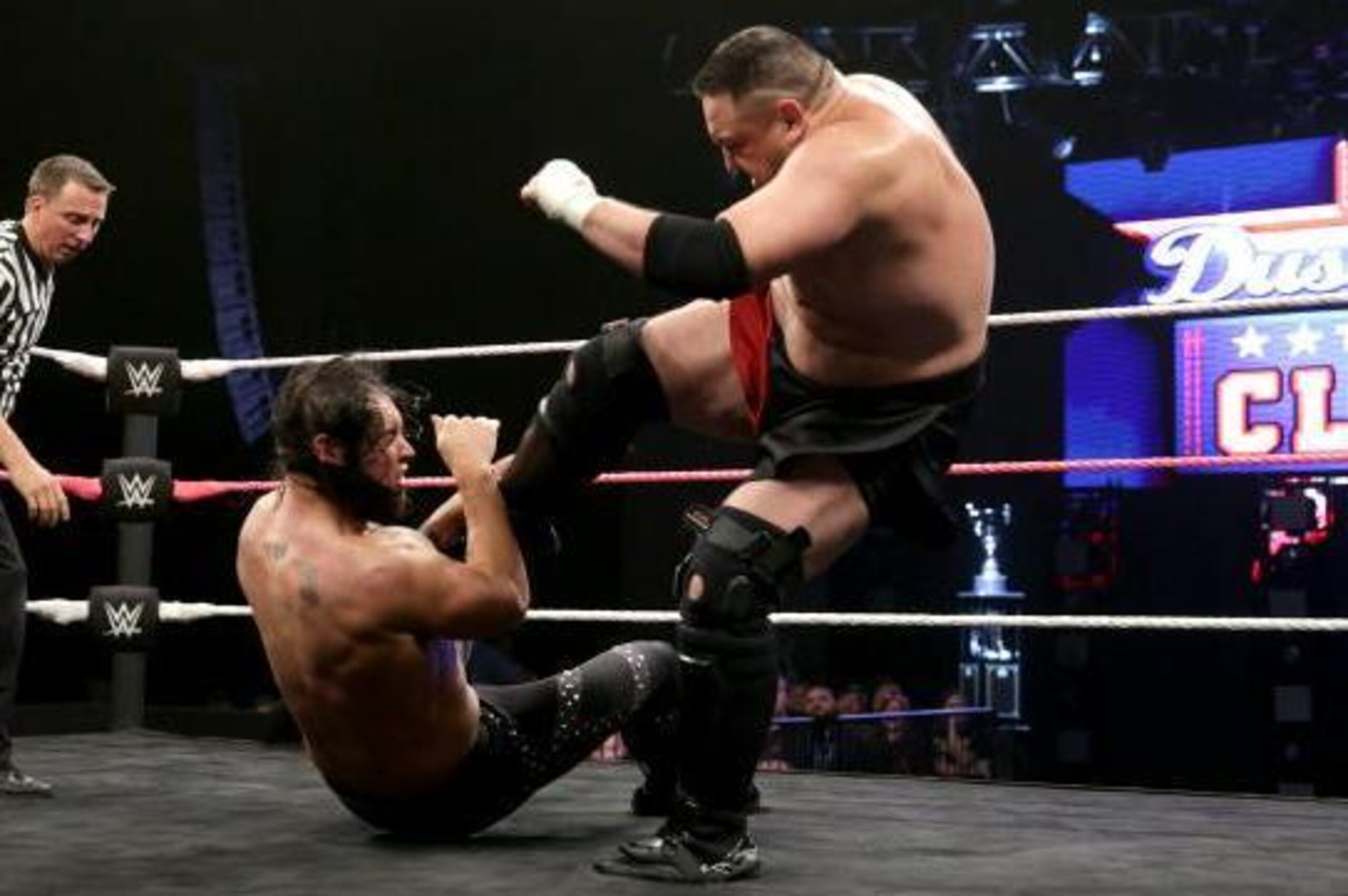 Samoa Joe attacks Baron Corbin.