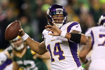 GREEN BAY, WI - JANUARY 05:  Quarterback Joe Webb #14 of the Minnesota Vikings throws the ball against the Green Bay Packers in the second quarter during the NFC Wild Card Playoff game at Lambeau Field on January 5, 2013 in Green Bay, Wisconsin.  (Photo b