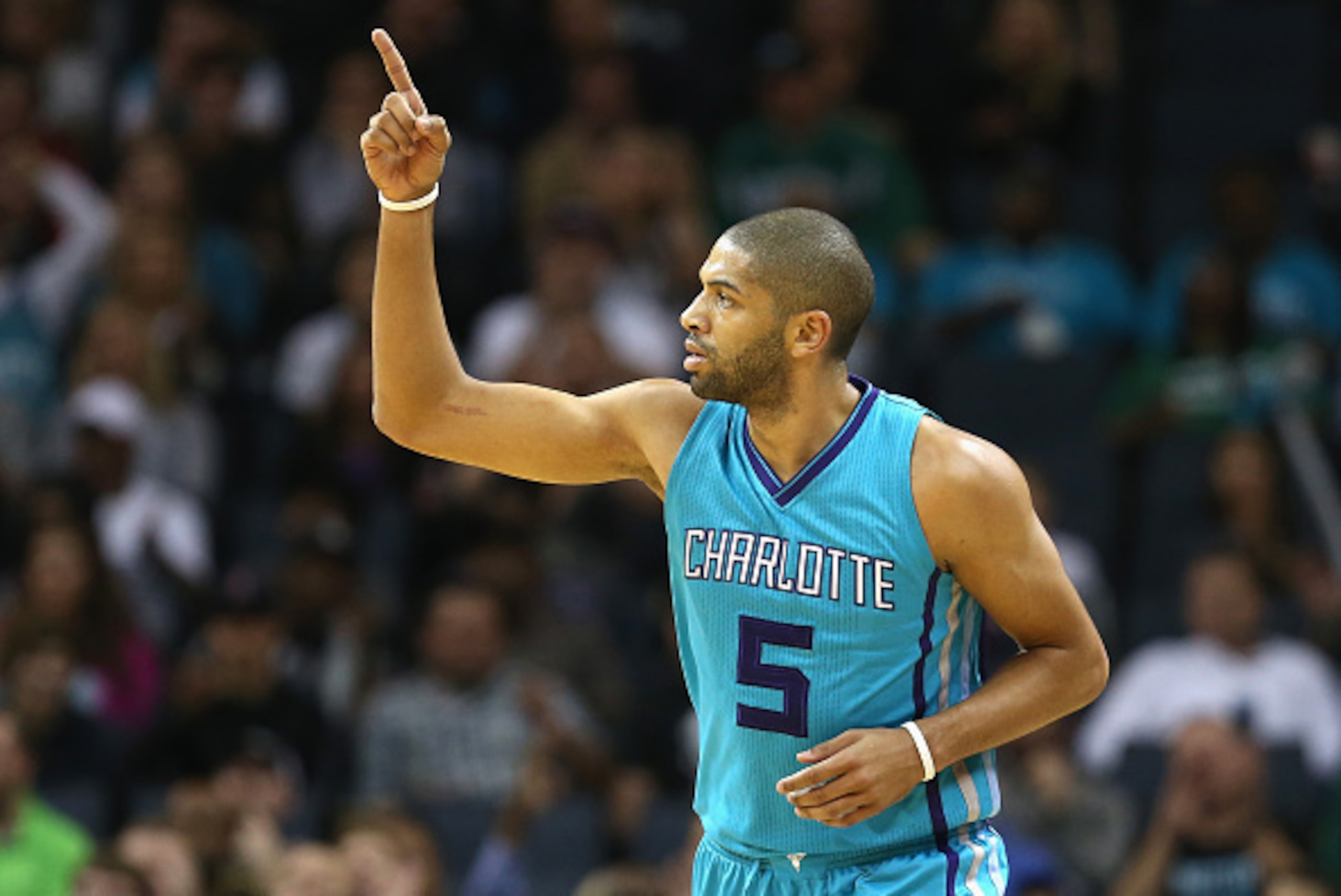CHARLOTTE, NC - DECEMBER 12:  Nicolas Batum #5 of the Charlotte Hornets reacts after a play during their game against the Boston Celtics at Time Warner Cable Arena on December 12, 2015 in Charlotte, North Carolina. NOTE TO USER: User expressly acknowledge