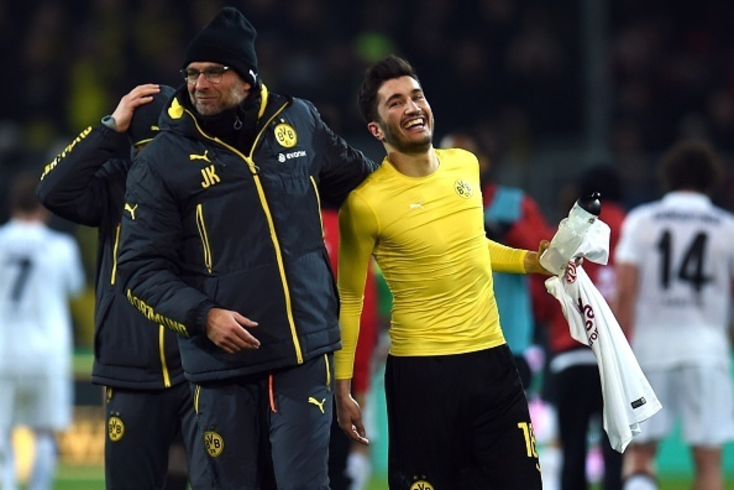 Dortmund's head coach Juergen Klopp and Dortmund's midfielder Nuri Sahin reacts after the German first division Bundesliga football match Borussia Dortmund v 1 FSV Mainz 05 in Dortmund, Germany, on February 13, 2015.  AFP PHOTO /  PATRIK STOLLARZ  DFL RUL