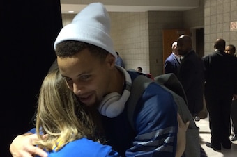 Curry spent the moments after the Warriors' first loss of the season offering a welcome hug to Becky Hankel, a woman with cancer who had just lost part of her leg.