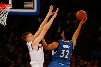 NEW YORK, NY - DECEMBER 16: Karl-Anthony Towns #32 of the Minnesota Timberwolves drives to the basket against Kristaps Porzingis #6 of the New York Knicks  at Madison Square Garden on December 16, 2015 in New York City. NOTE TO USER: User expressly acknow