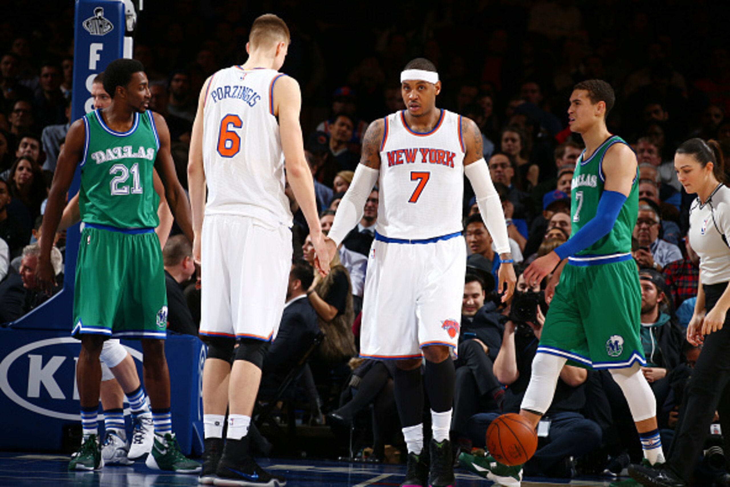 NEW YORK, NY - DECEMBER 7:  Carmelo Anthony #7 of the New York Knicks shakes hands with Kristaps Porzingis #6 of the New York Knicks during the game against the Dallas Mavericks on December 7, 2015 at Madison Square Garden in New York City, New York.  NOT