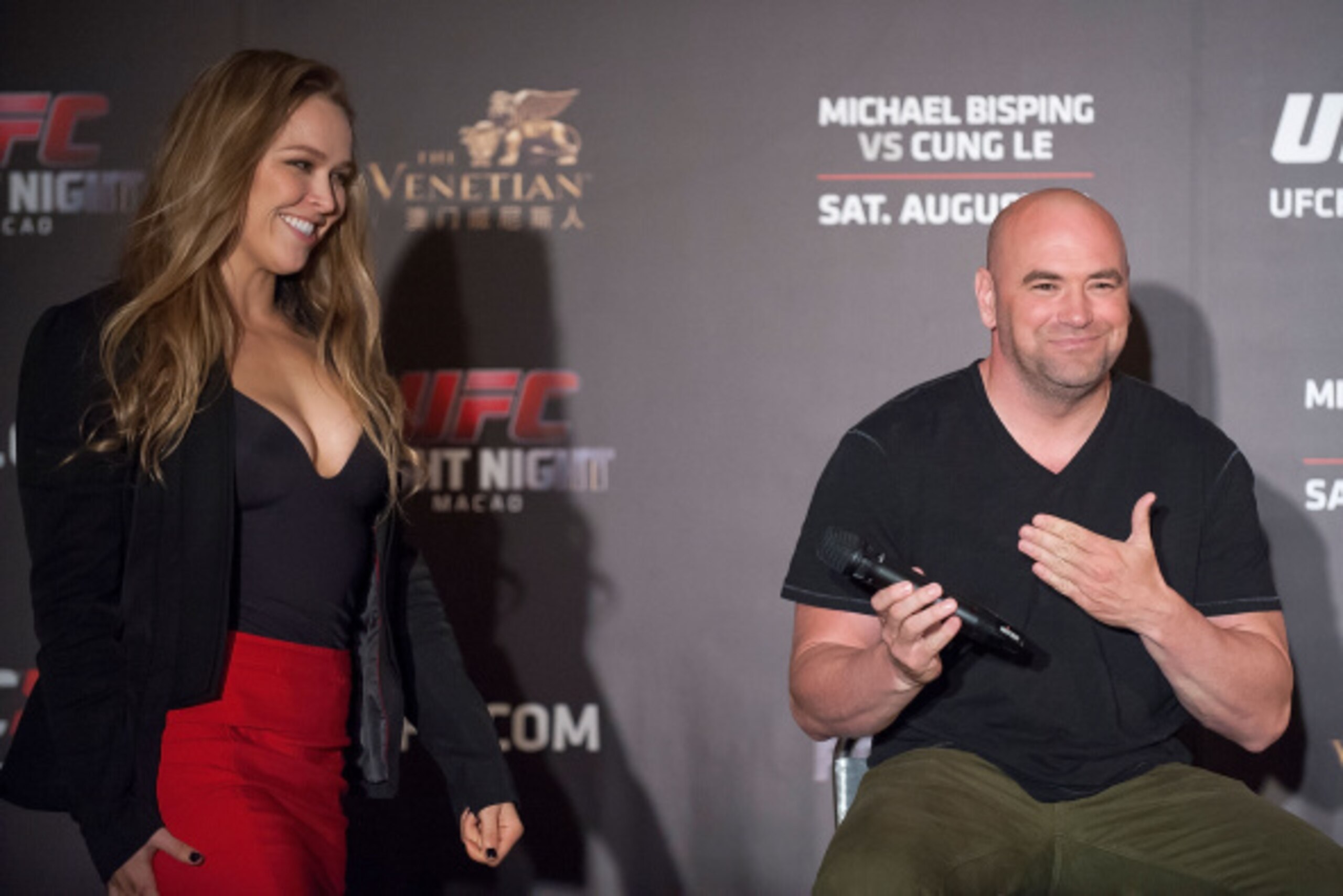 HONG KONG - AUGUST 20:  UFC President Dana White, right, introduces UFC women's bantamweight champion  Ronda Rousey on the stage for a Q&A session during the Macao UFC Fight Night Press Conference at the Four Season Hotel on August 20, 2014 in Hong Kong. 