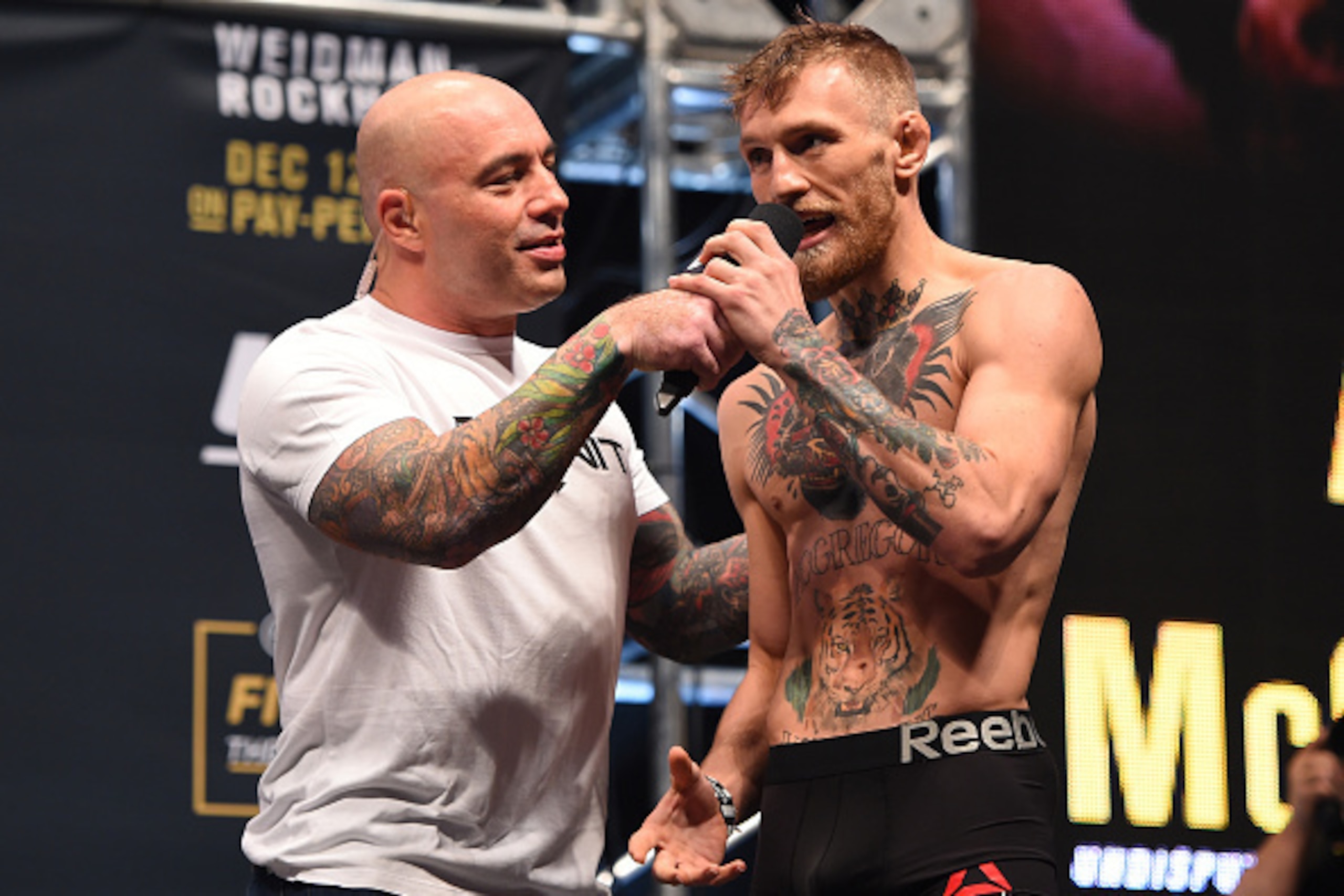 LAS VEGAS, NV - DECEMBER 11:   Conor McGregor of Ireland is interviewed by Joe Rogan after weigh-in in during the UFC 194 weigh-in inside MGM Grand Garden Arena on December 10, 2015 in Las Vegas, Nevada.  (Photo by Josh Hedges/Zuffa LLC/Zuffa LLC via Gett