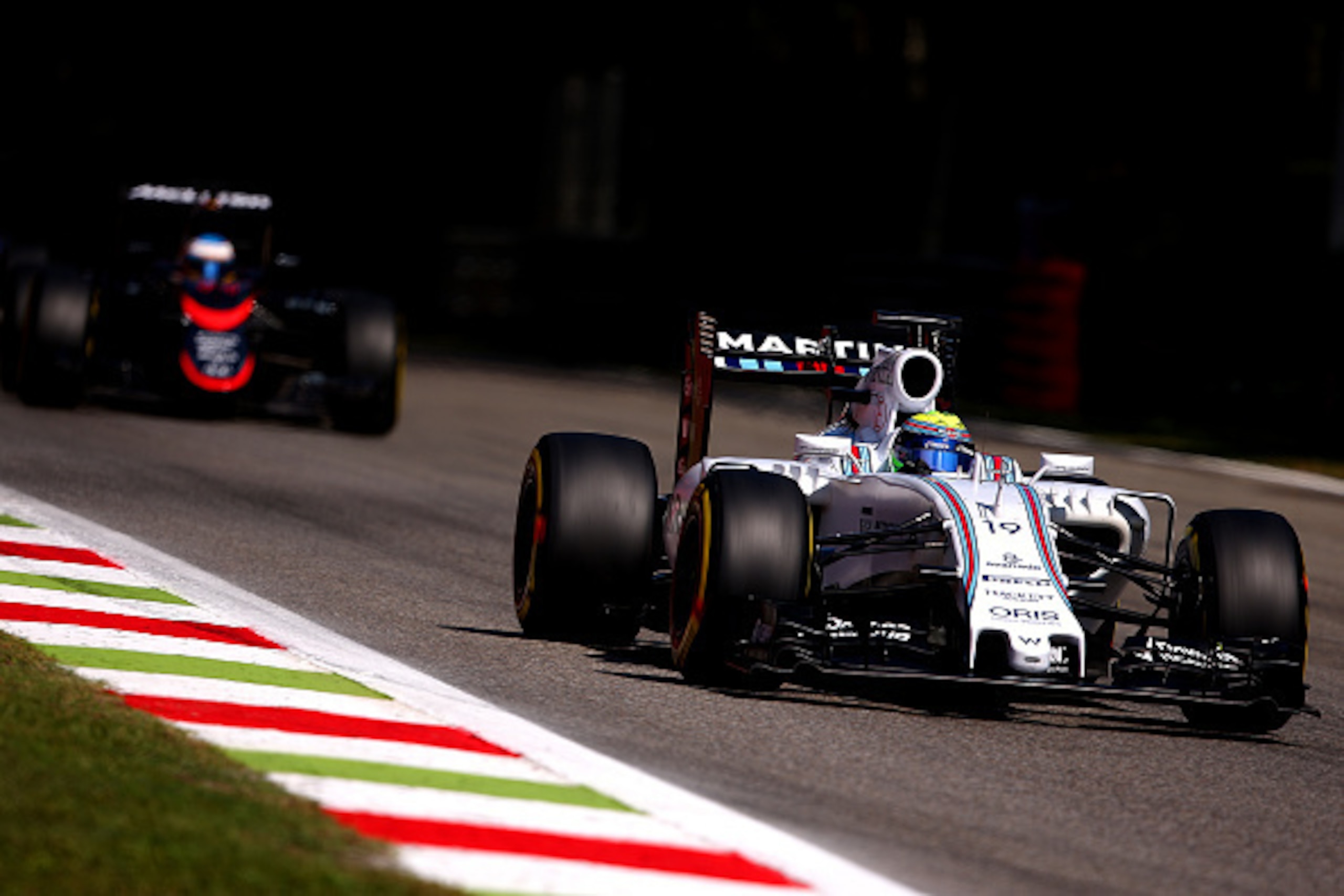 MONZA, ITALY - SEPTEMBER 05:  Felipe Massa of Brazil and Williams drives ahead of Fernando Alonso of Spain and McLaren Honda during qualifying for the Formula One Grand Prix of Italy at Autodromo di Monza on September 5, 2015 in Monza, Italy.  (Photo by B