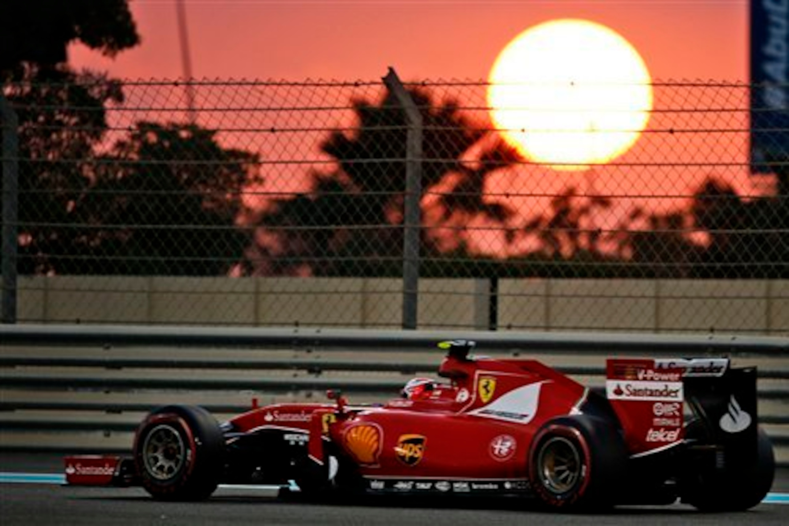 The sun sets behind Kimi Raikkonen.