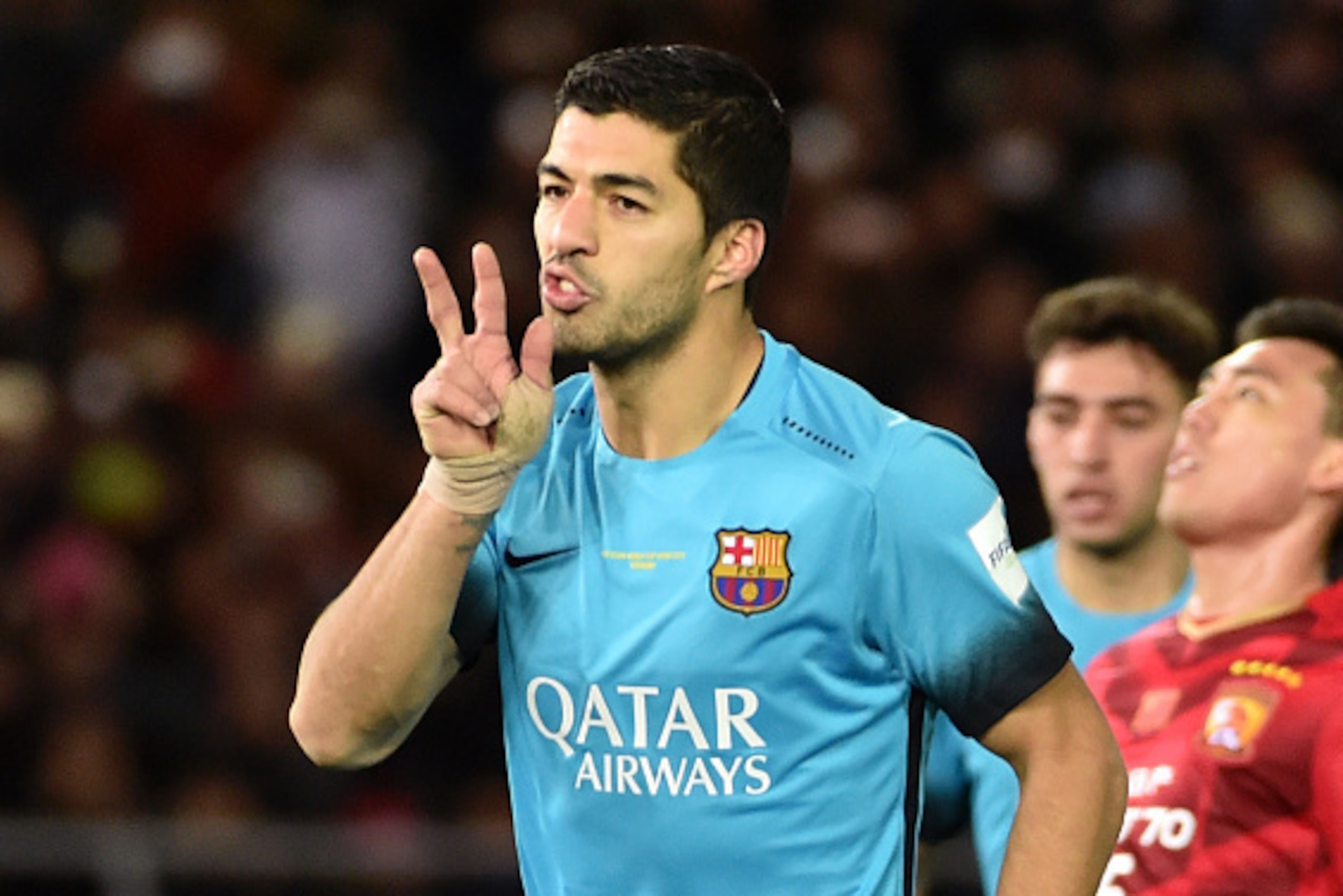 Barcelona forward Luis Suarez celebrates his goal against Guangzhou Evergrande during their Club World Cup semi-final football match in Yokohama on December 17, 2015.  AFP PHOTO / KAZUHIRO NOGI / AFP / KAZUHIRO NOGI        (Photo credit should read KAZUHI
