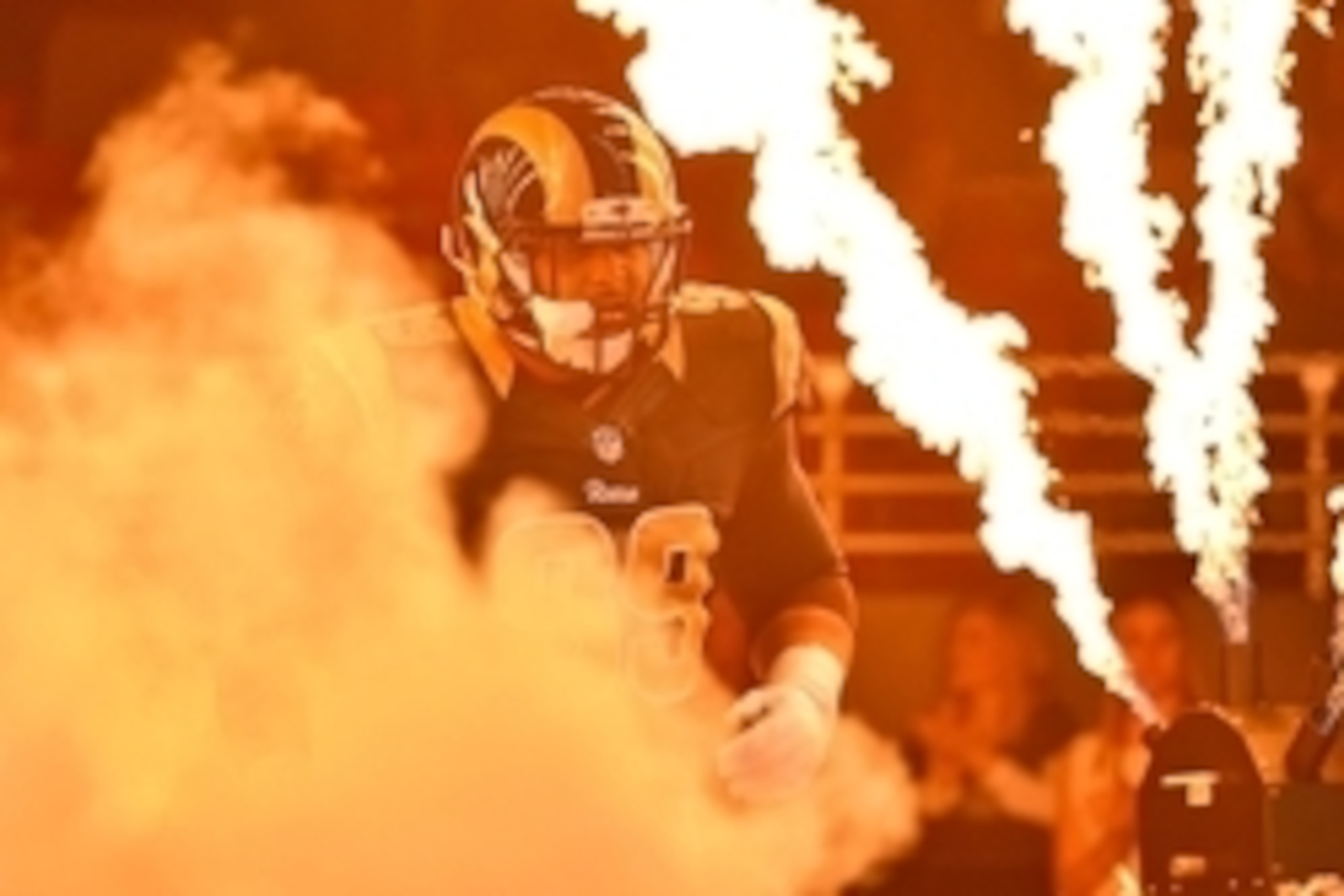 Dec 13, 2015; St. Louis, MO, USA; St. Louis Rams defensive tackle Aaron Donald (99) runs onto the field during player introductions before the game between the St. Louis Rams and the Detroit Lions at the Edward Jones Dome. Mandatory Credit: Jasen Vinlove-