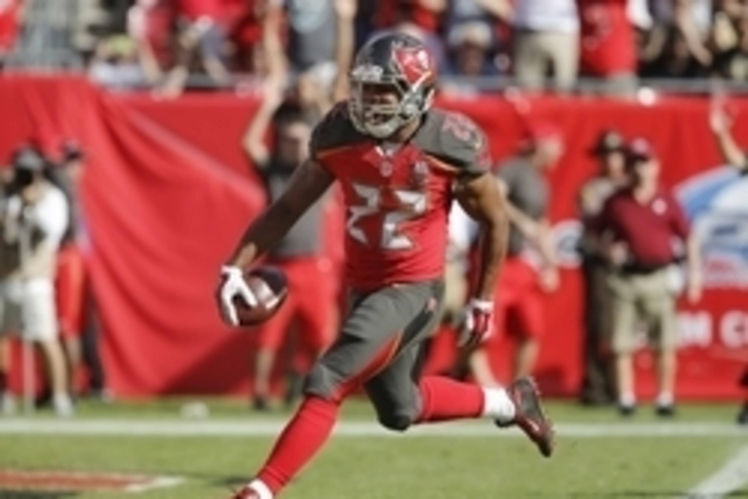 Dec 13, 2015; Tampa, FL, USA; Tampa Bay Buccaneers running back Doug Martin (22) runs for a touchdown during the second quarter against the New Orleans Saints at Raymond James Stadium. Mandatory Credit: Reinhold Matay-USA TODAY Sports