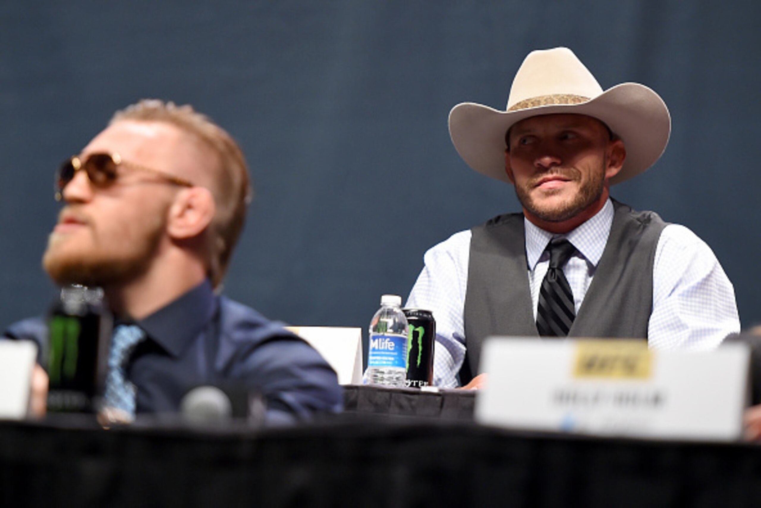 LAS VEGAS, NEVADA - SEPTEMBER 04:  (R-L) UFC lightweight title challenger Donald 'Cowboy' Cerrone exchanges words with UFC interim featherweight champion Conor McGregor during the UFC's Go Big launch event inside MGM Grand Garden Arena on September 4, 201