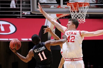 SALT LAKE CITY, UT- NOVEMBER 16: Jakob Poeltl #42 of the Utah Utes defends against D'Erryl Williams #11 of the San Diego State Aztecs at the Jon M. Huntsman Center on November 16, 2015 in Salt Lake City, Utah. (Photo by Gene Sweeney Jr/Getty Images)