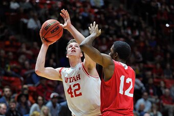SALT LAKE CITY, UT- NOVEMBER 13: Jakob Poeltl #42 of the Utah Utes looks to shoot over Daniel Melifonwu #12 of the Southern Utah Thunderbirds in the first half at the Jon M. Huntsman Center on November 13, 2015 in Salt Lake City, Utah. (Photo by Gene Swee