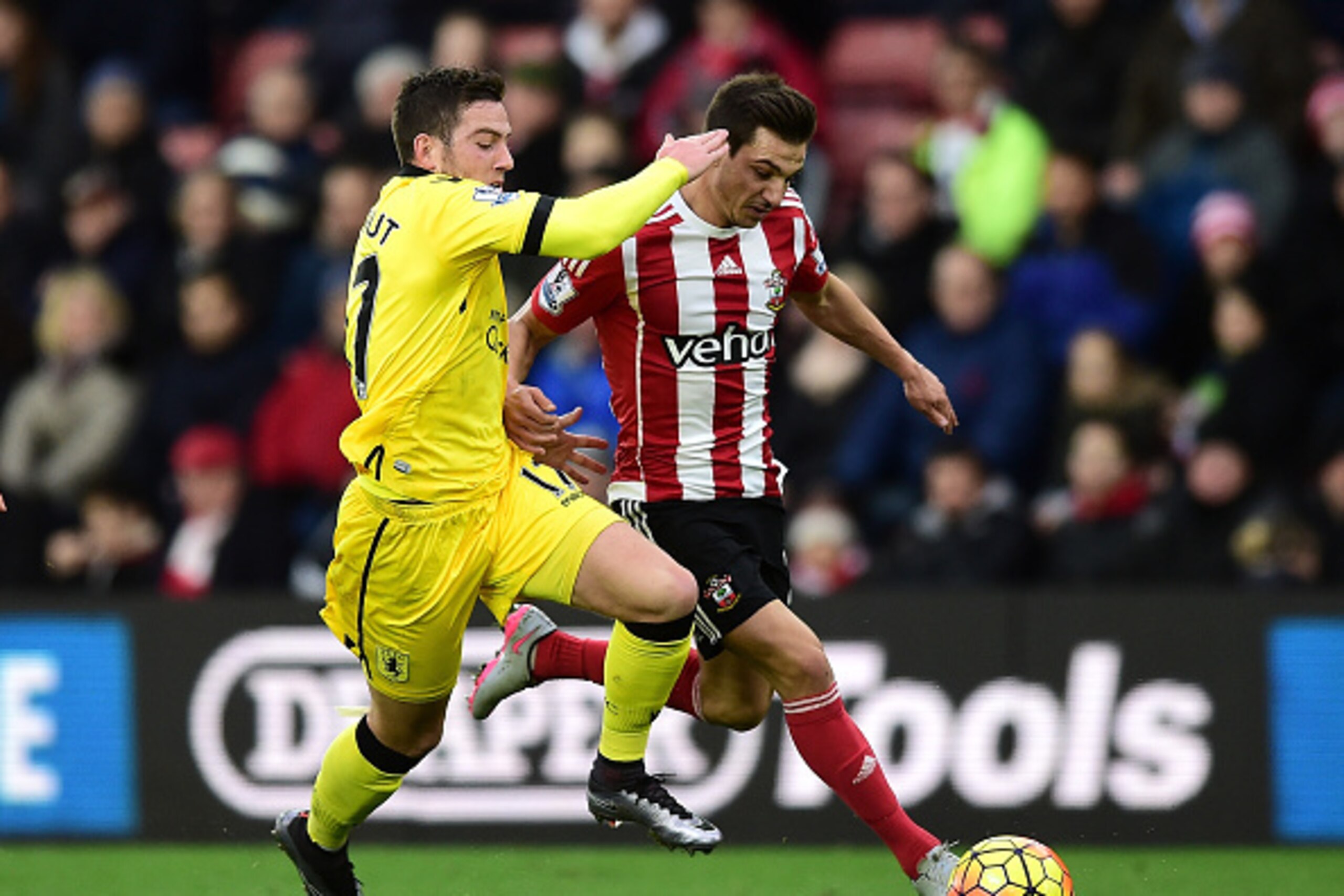 SOUTHAMPTON, ENGLAND - DECEMBER 05: Cedric Soares of Southampton and Jordan Veretout of Aston Villa compete for the ball during the Barclays Premier League match between Southampton and Aston Villa at St Mary's Stadium on December 5, 2015 in Southampton, 