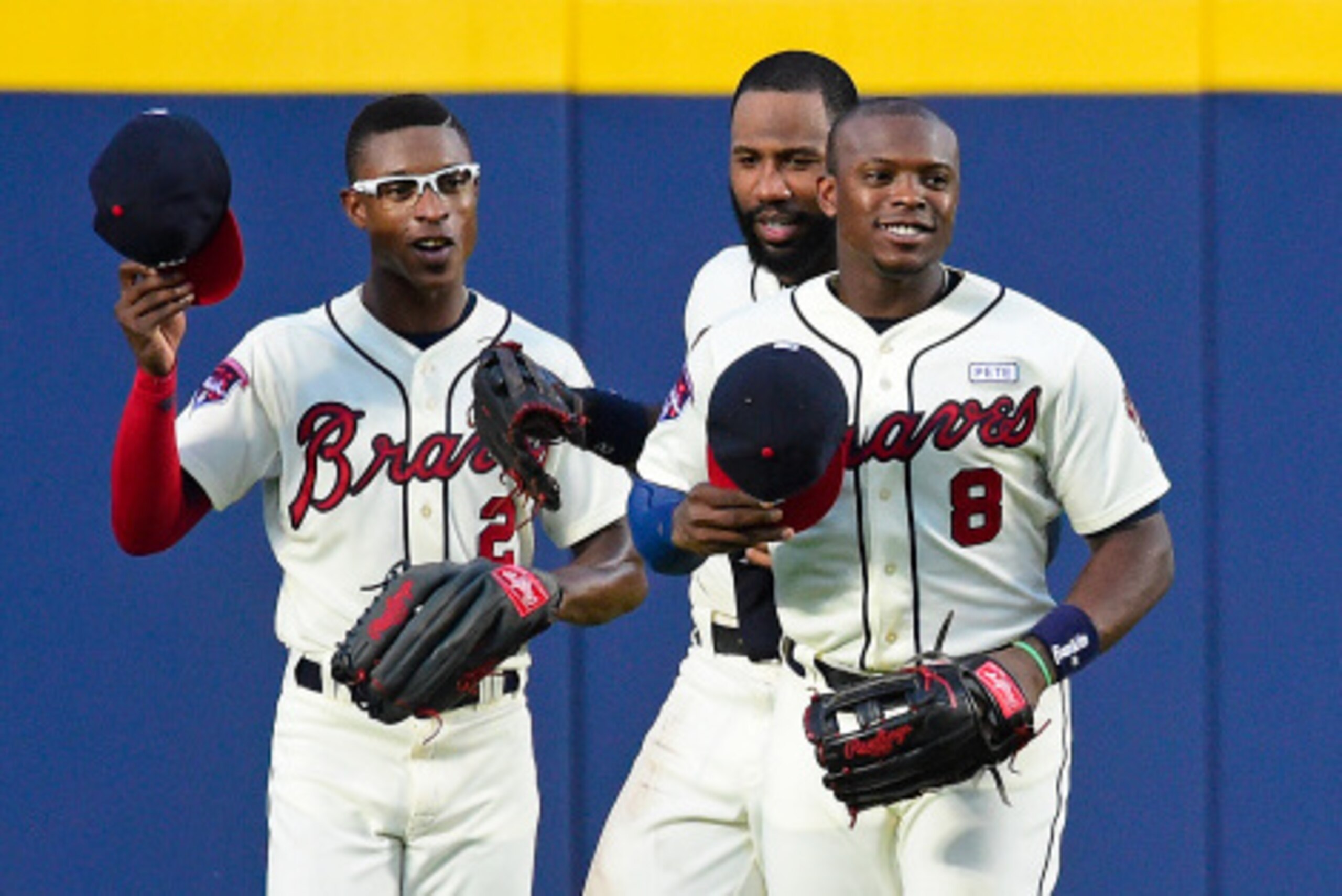 ATLANTA, GA - AUGUST 31: B. J. Upton #2, Jason Heyward #22, and Justin Upton #8 of the Atlanta Braves (L-R) celebrate after the game against the Miami Marlins at Turner Field on August 31, 2014 in Atlanta, Georgia. (Photo by Scott Cunningham/Getty Images)