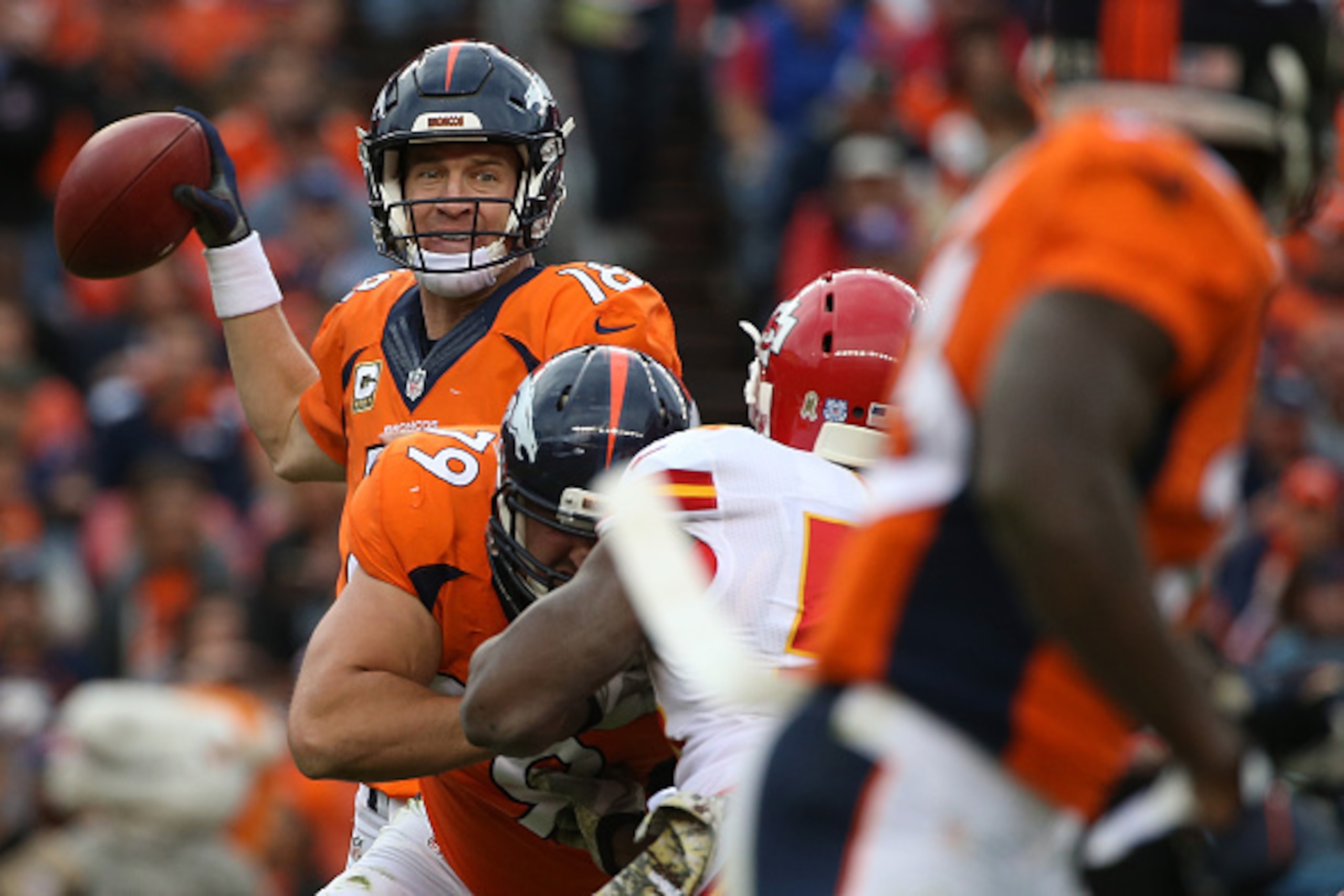 DENVER, CO - NOVEMBER 15:  Quarterback Peyton Manning #18 of the Denver Broncos delivers a pass against the Kansas City Chiefs at Sports Authority Field at Mile High on November 15, 2015 in Denver, Colorado. The Chiefs defeated the Broncos 29-13.  (Photo 