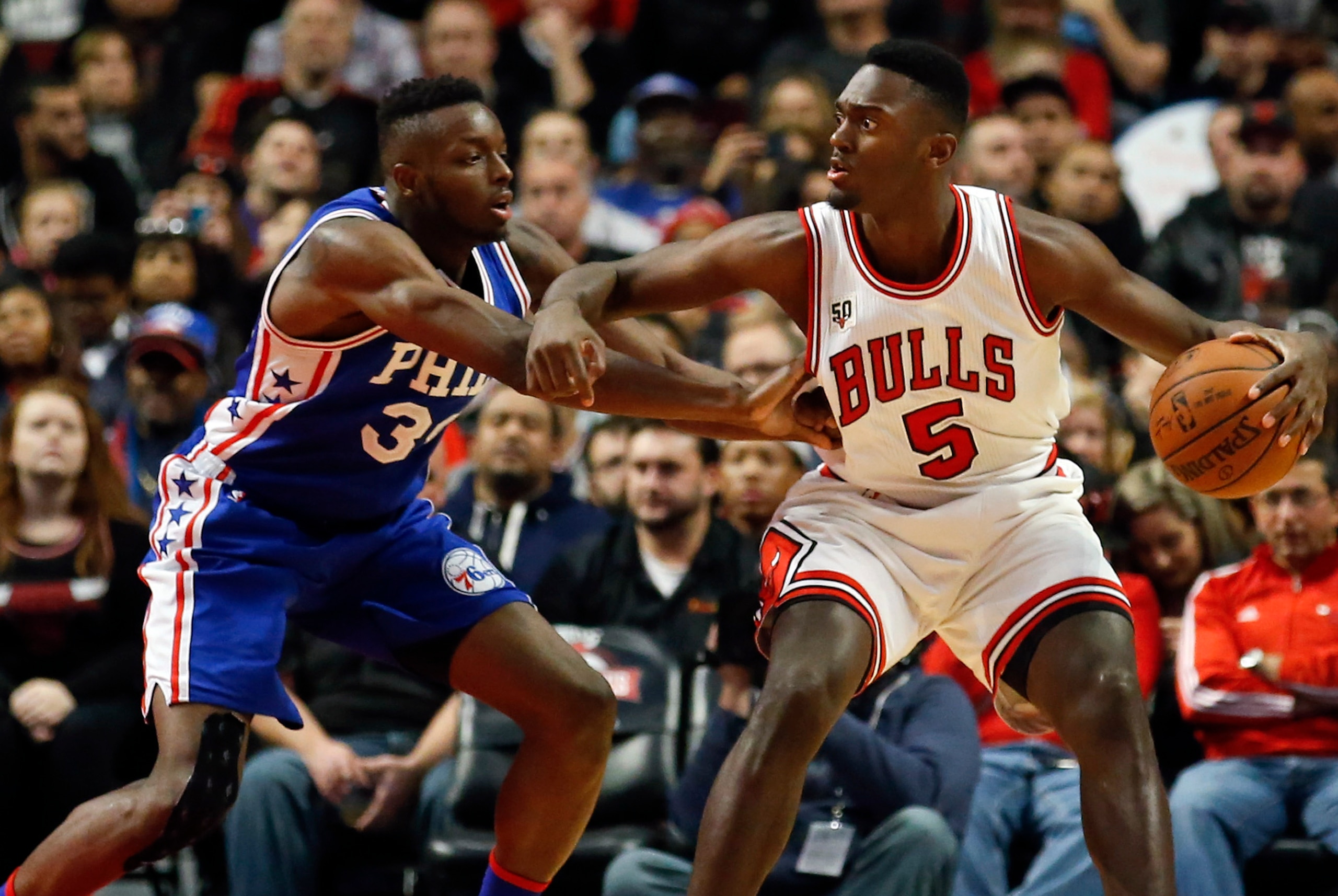Dec 14, 2015; Chicago, IL, USA; Chicago Bulls forward Bobby Portis (5) works against Philadelphia 76ers forward Jerami Grant (39) during the second half at United Center. The Bulls won 115-96. Mandatory Credit: Kamil Krzaczynski-USA TODAY Sports