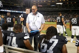 Offensive line coach Mike Tice coaching up the Raiders offensive linemen in a preseason game