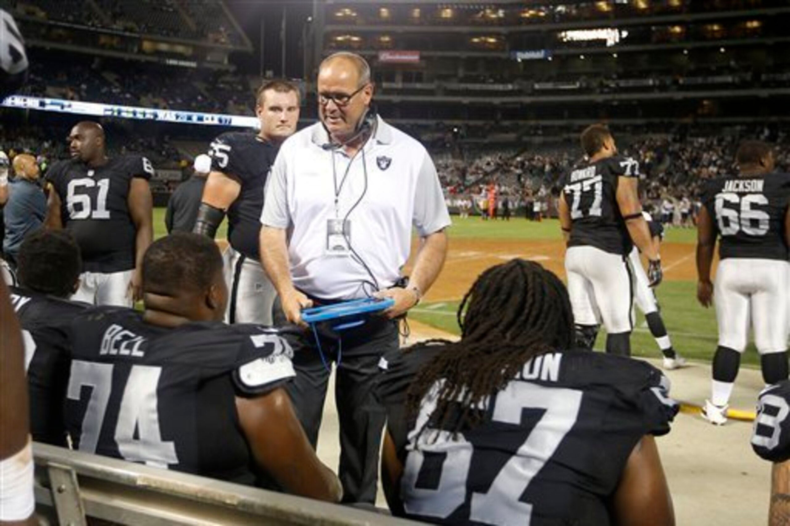 Offensive line coach Mike Tice coaching up the Raiders offensive linemen in a preseason game